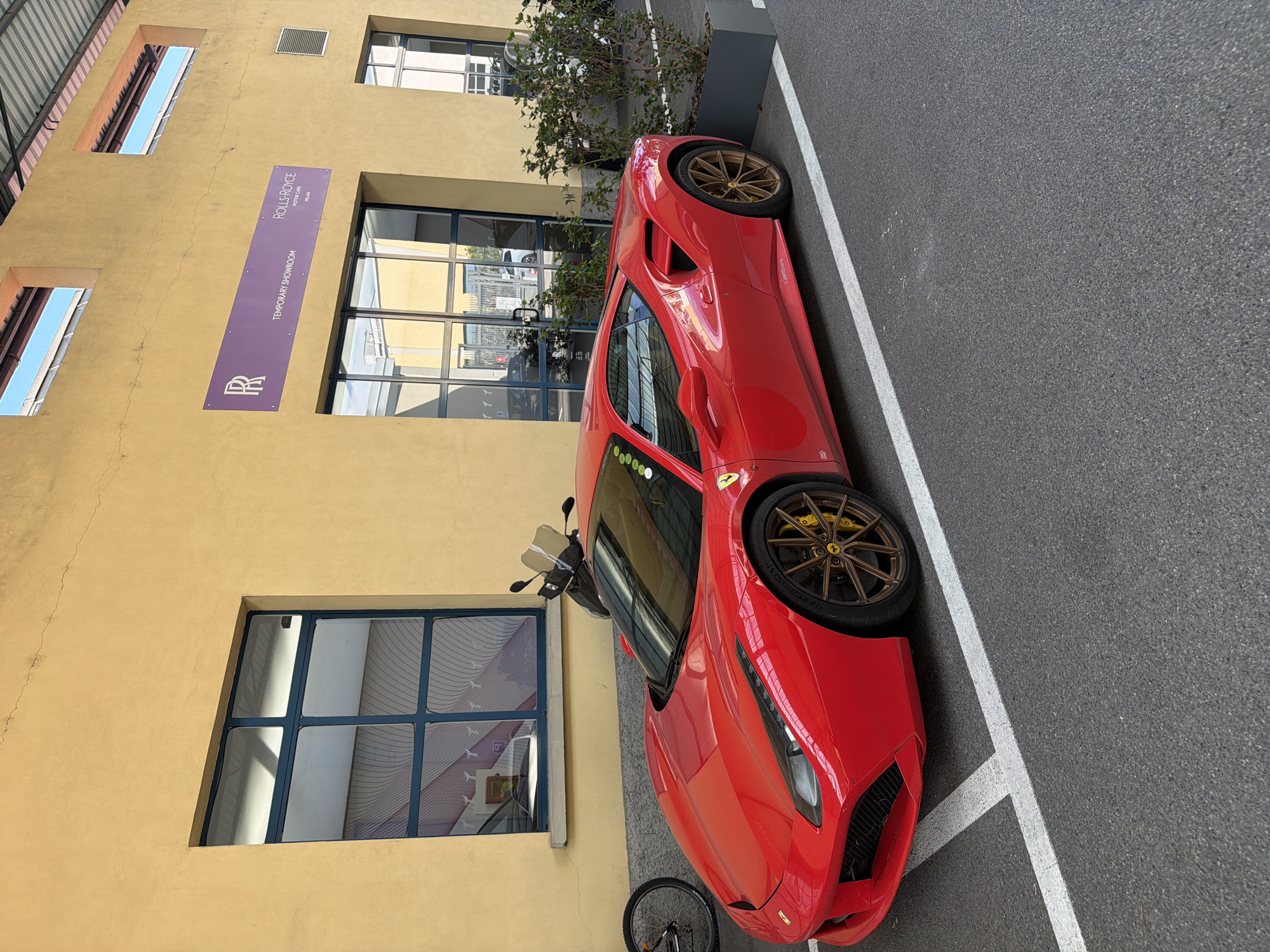 Luxury car collection at Milan automotive showroom and workshop
