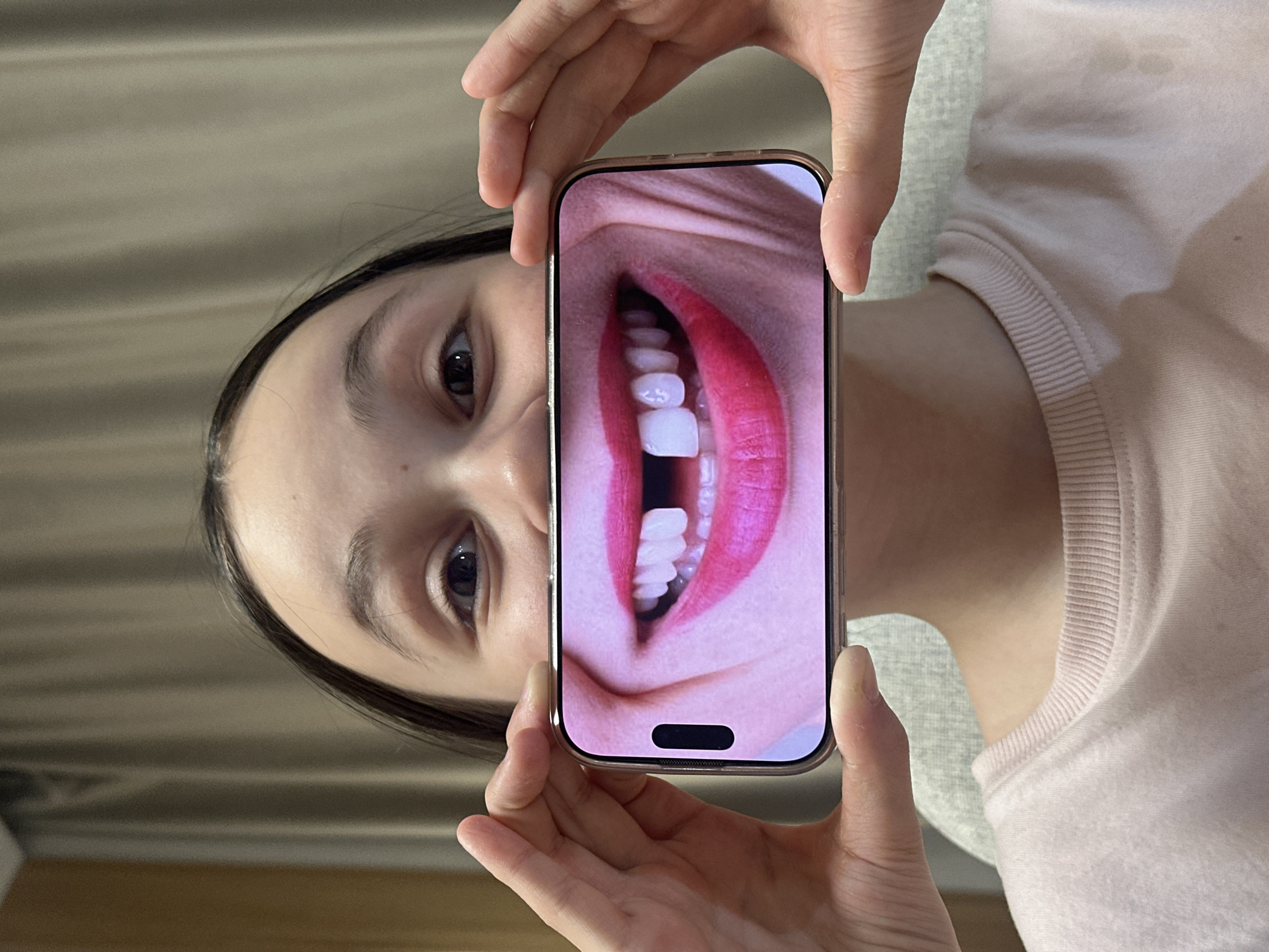 Young person takes smartphone selfies in Votkinsk, Russia