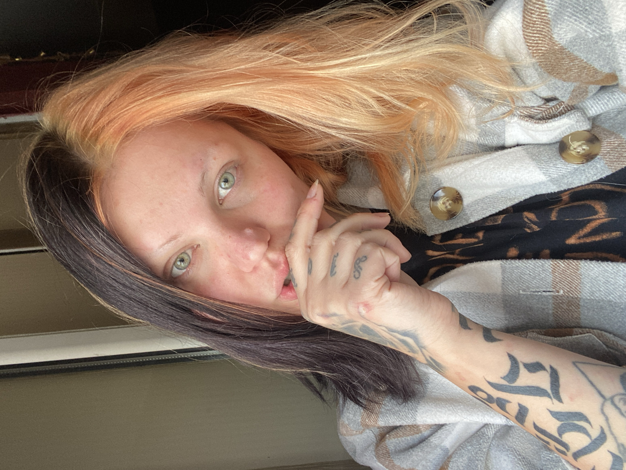 Woman with distinctive hair smokes cigarette in Montenegro village