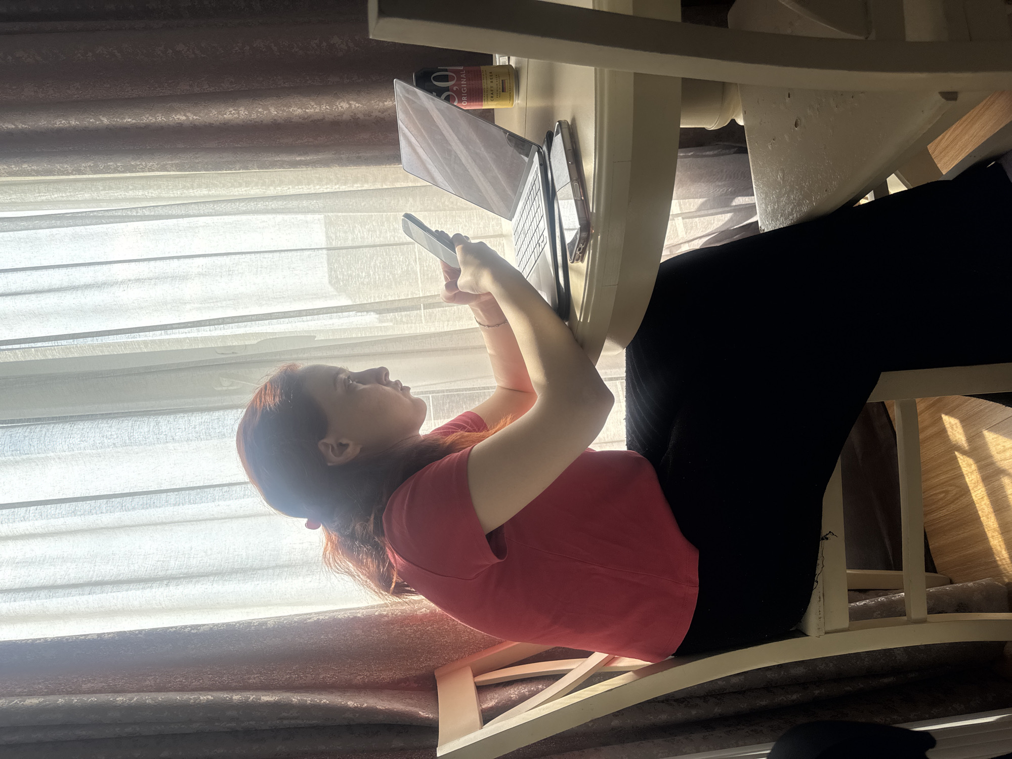 Women relax with phones on couches in Tbilisi homes