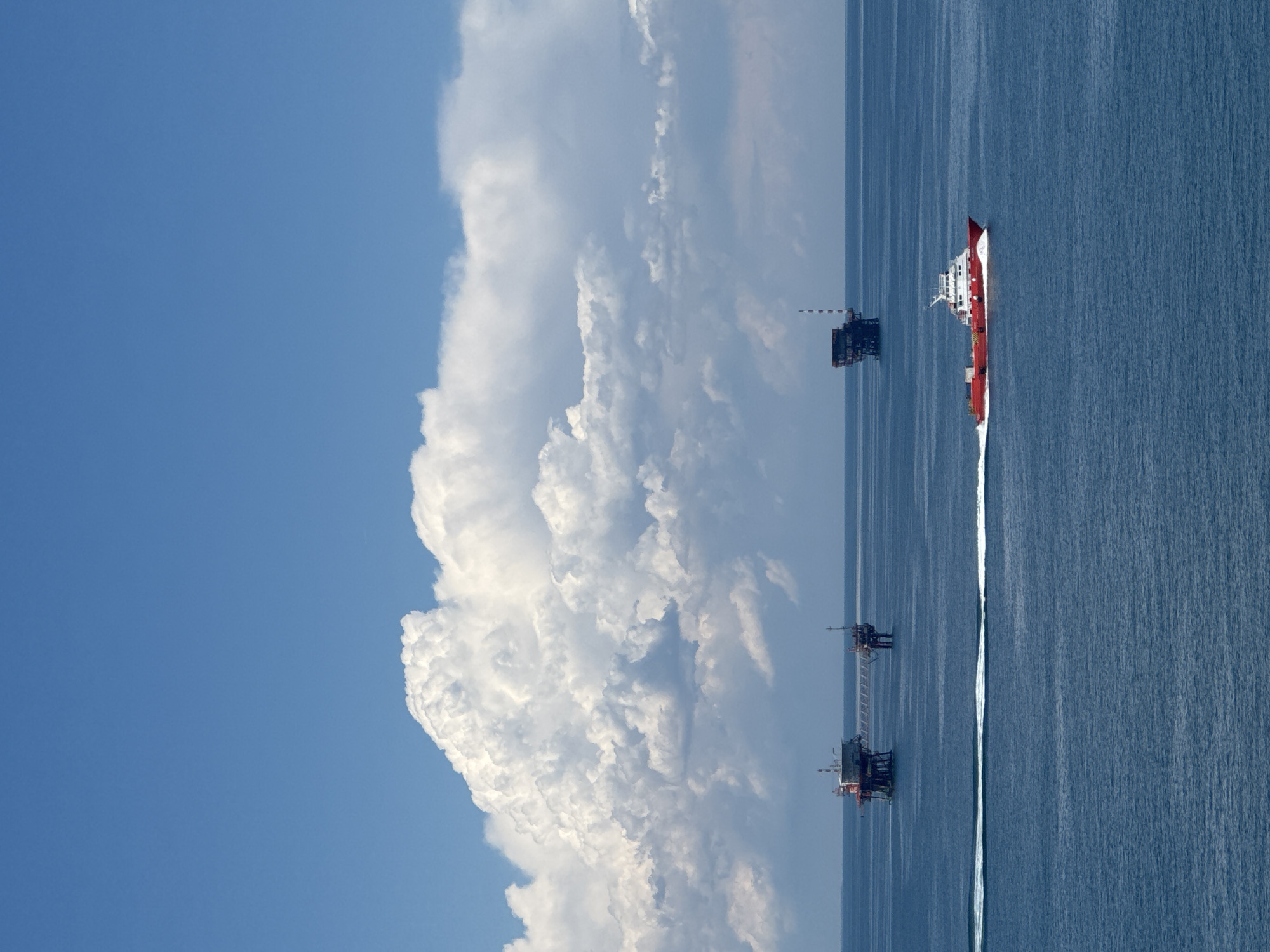 Supply vessel transits Italian offshore oil platforms during afternoon