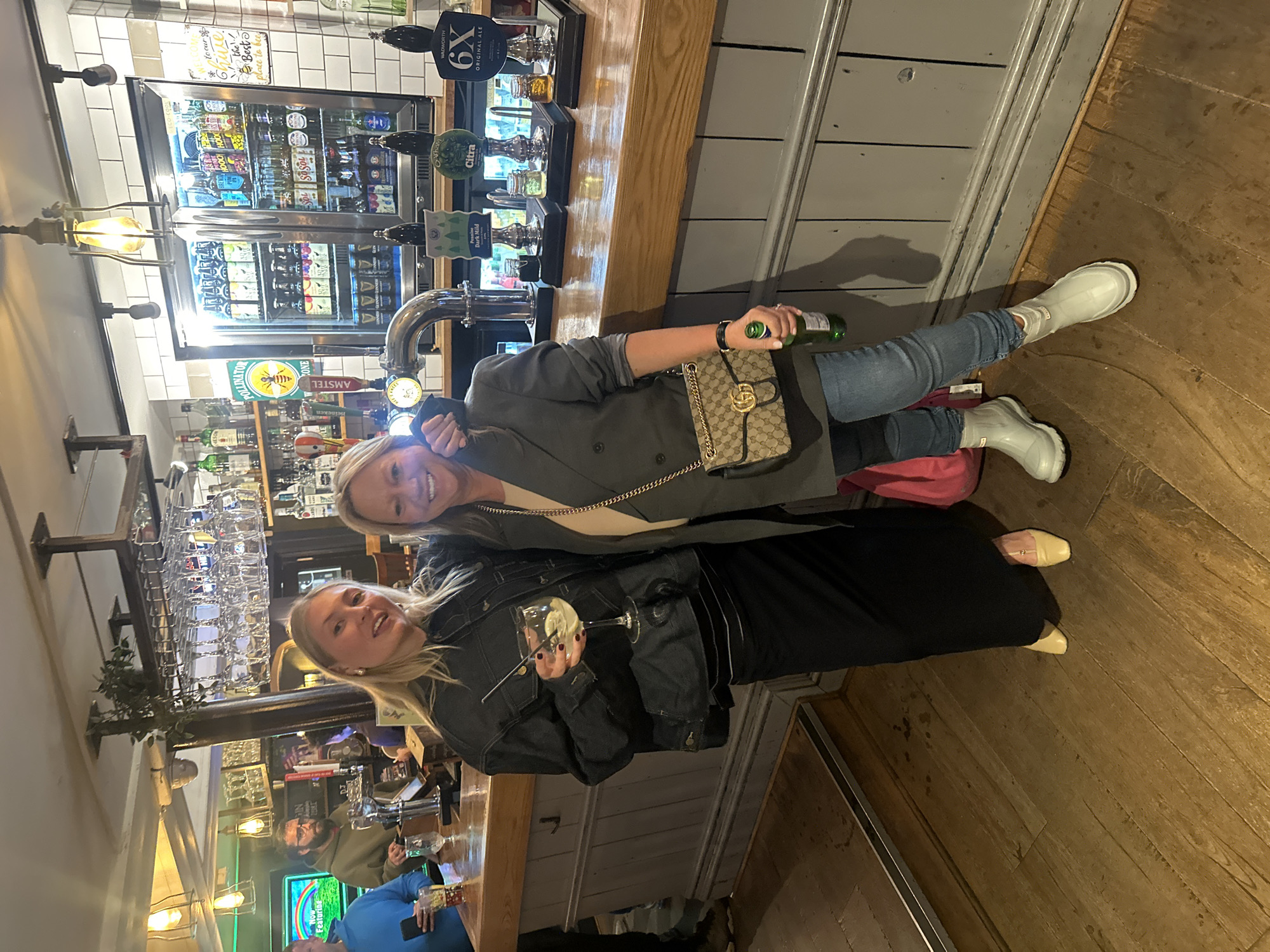 Two women share drinks at St Albans pub