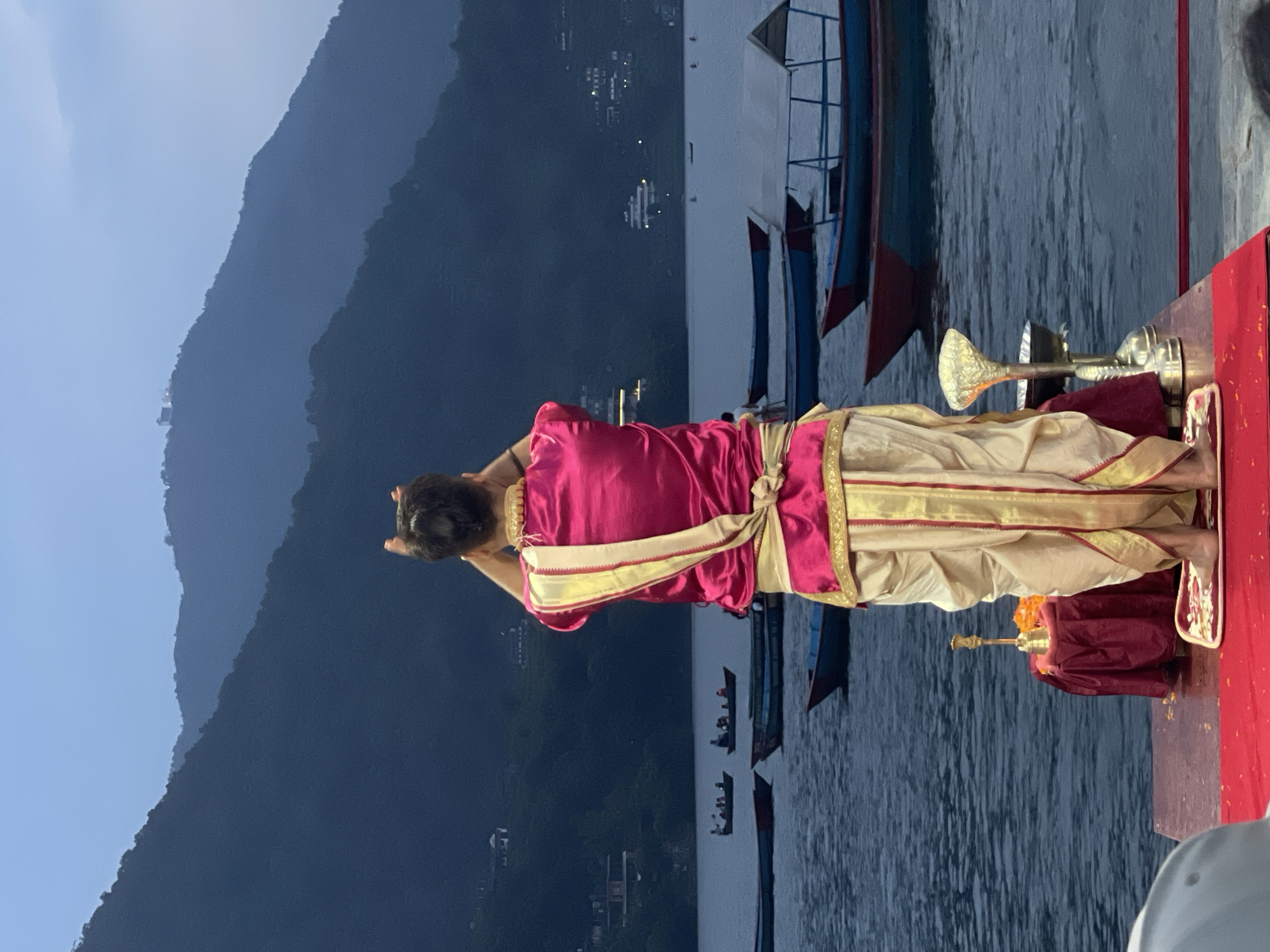 Religious ceremony held on waterfront platform in Pokhara, Nepal