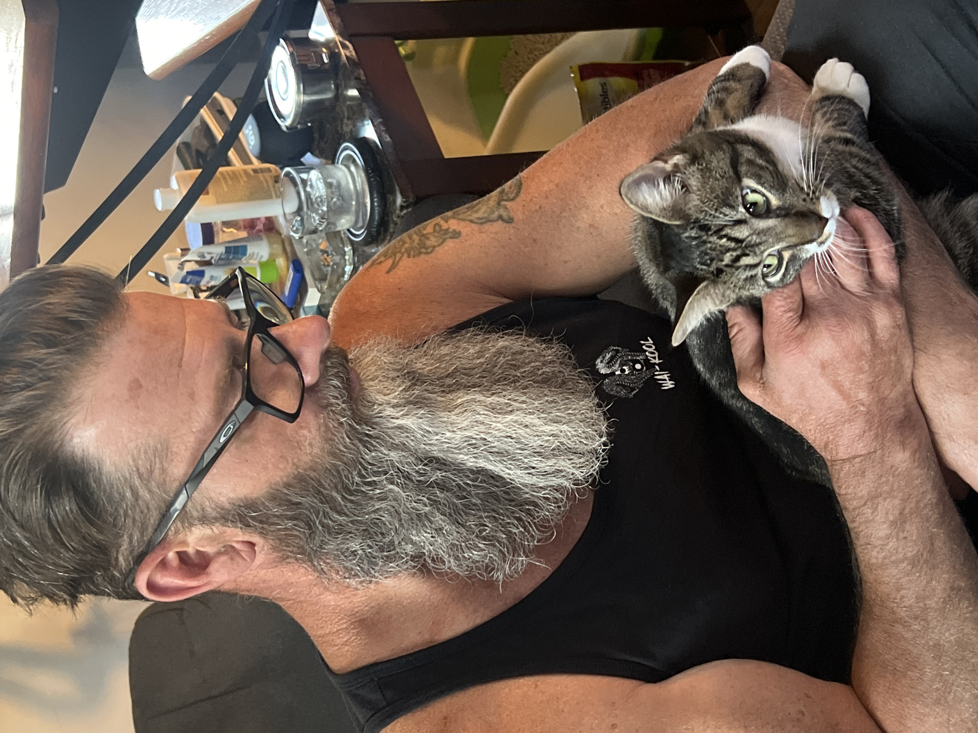 Man with cat photographed wearing motivational shirt in Newburgh