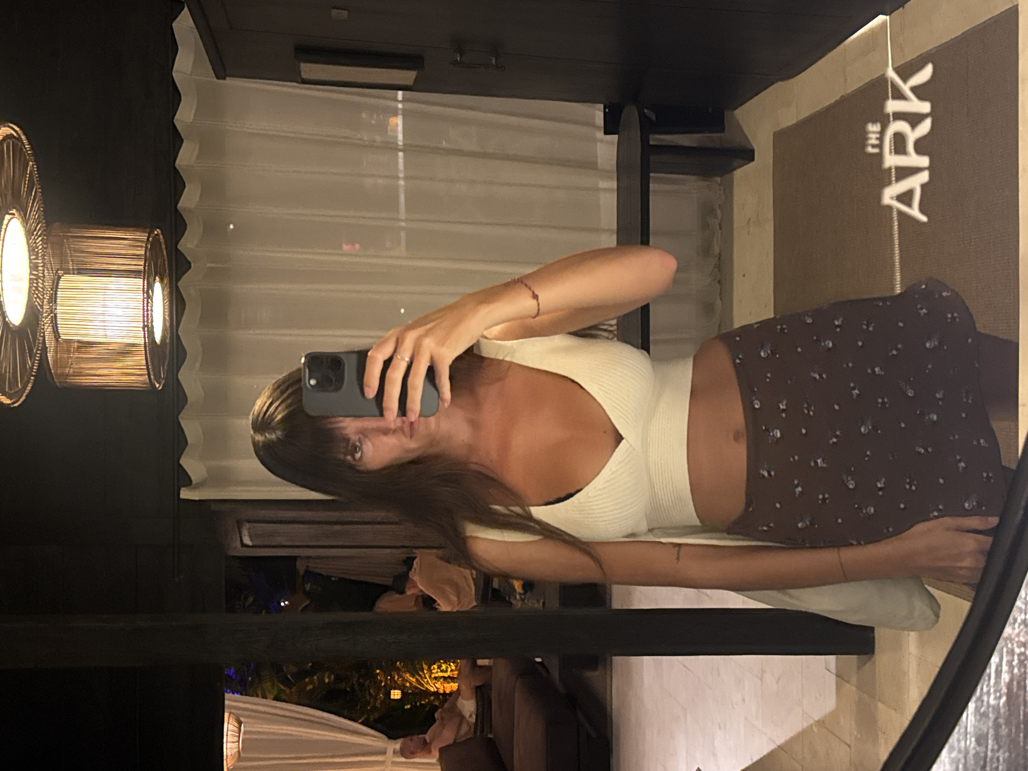 Woman takes mirror selfies, DJ performs in Bali