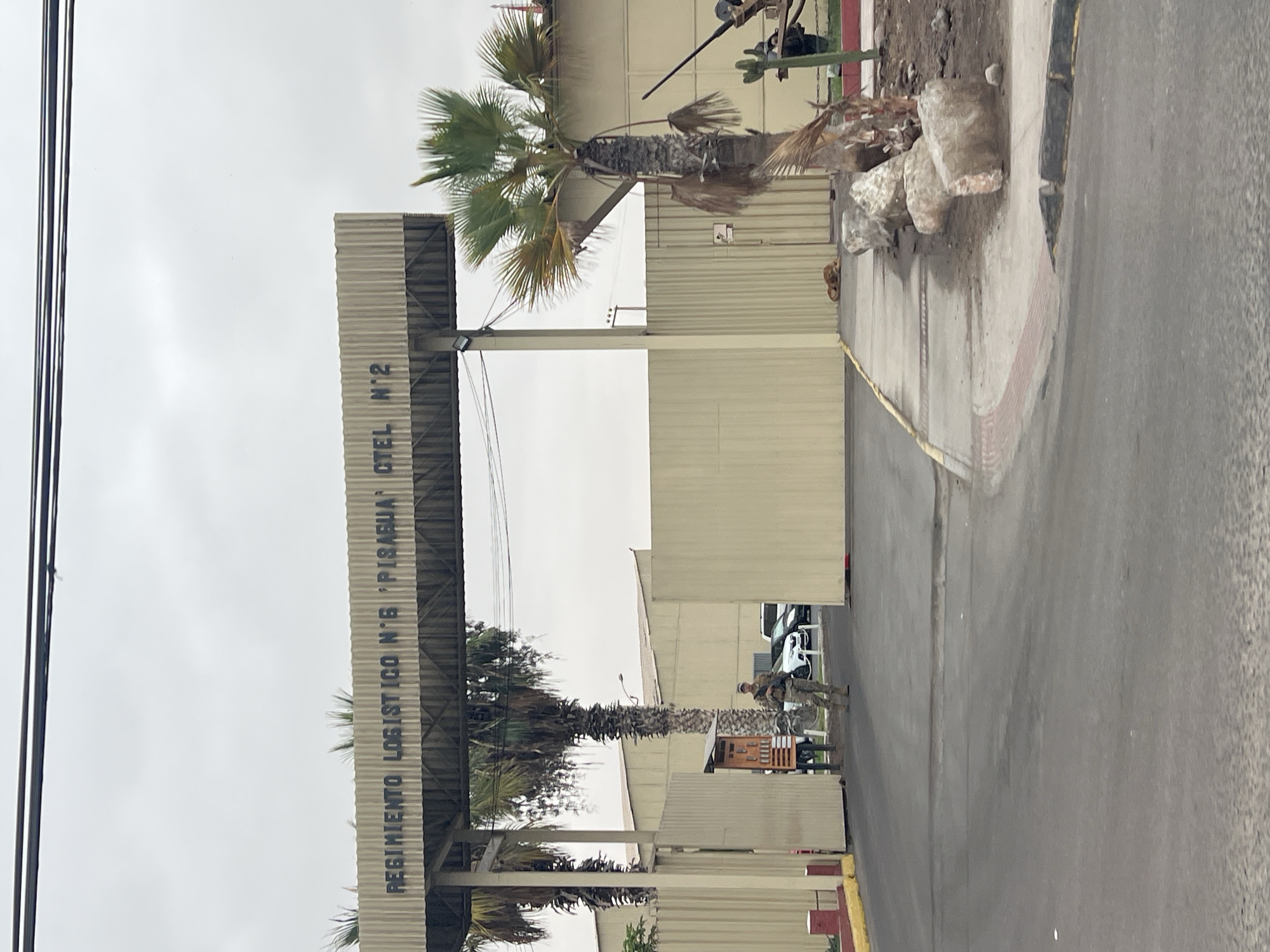 Street scenes captured near military facility and gas station in Arica