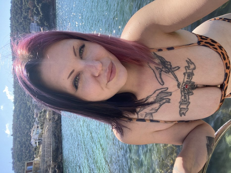 Woman with pink hair photographed at Montenegro coastal locations