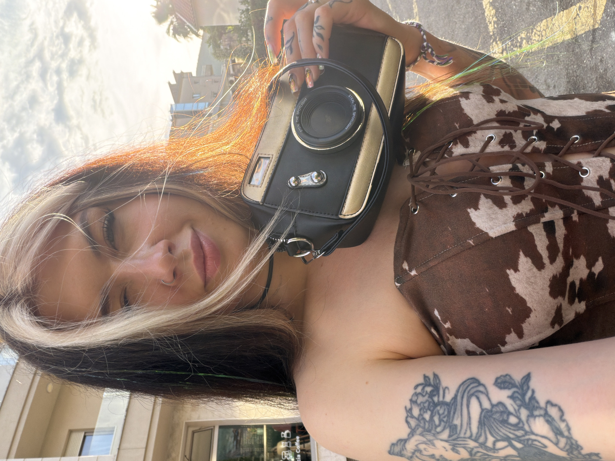 Woman takes selfies with child in Budva, Montenegro