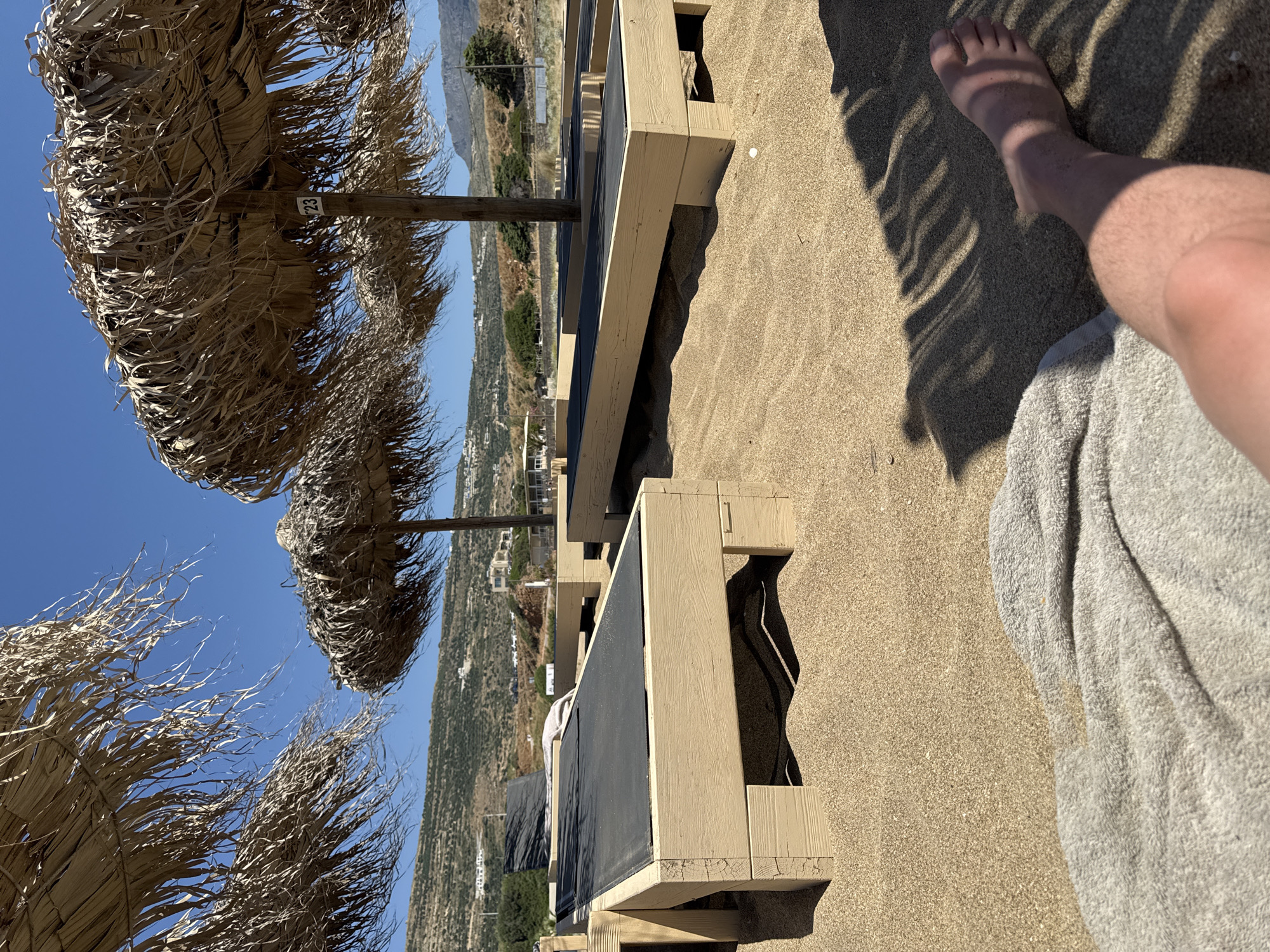 Beachgoer enjoys midday relaxation at Falasarna Beach, Greece
