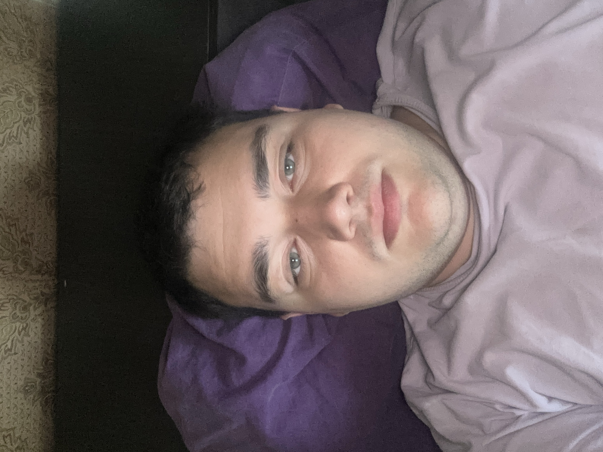 Lazy morning selfie session on a purple pillow