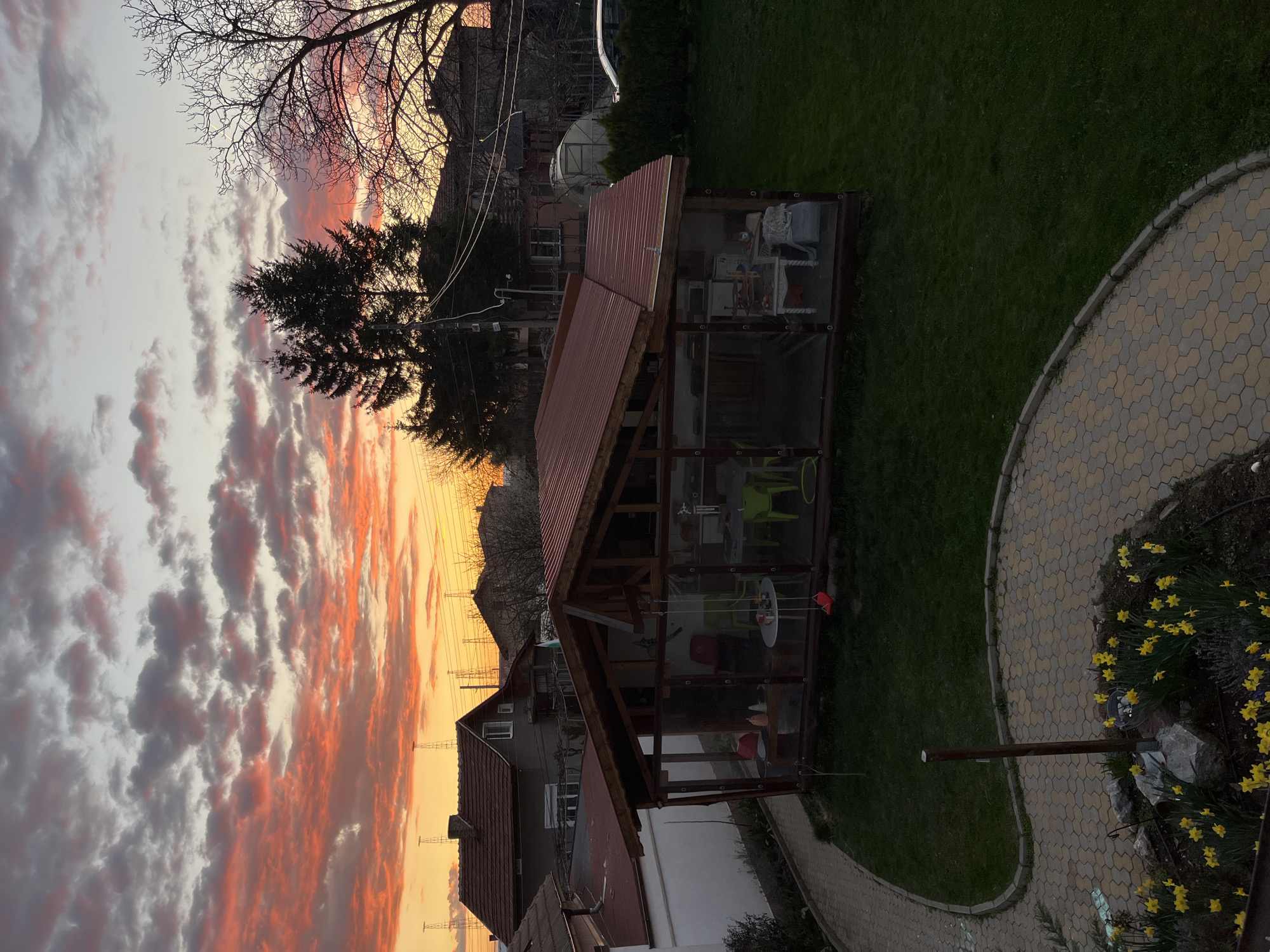 Spring afternoon captured in Kostinbrod: sunset, blossoms, child playing