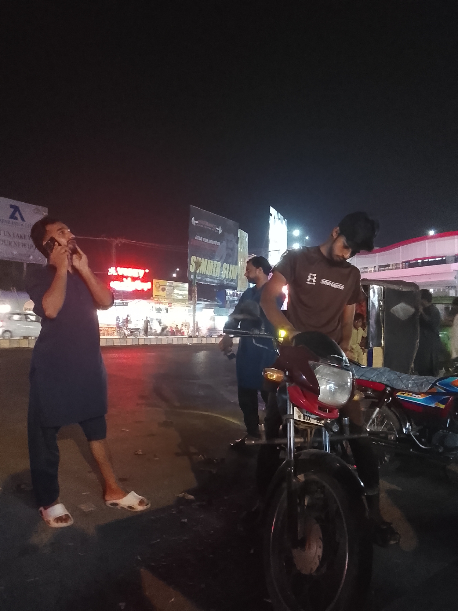 Evening snooker games and street life documented in urban area