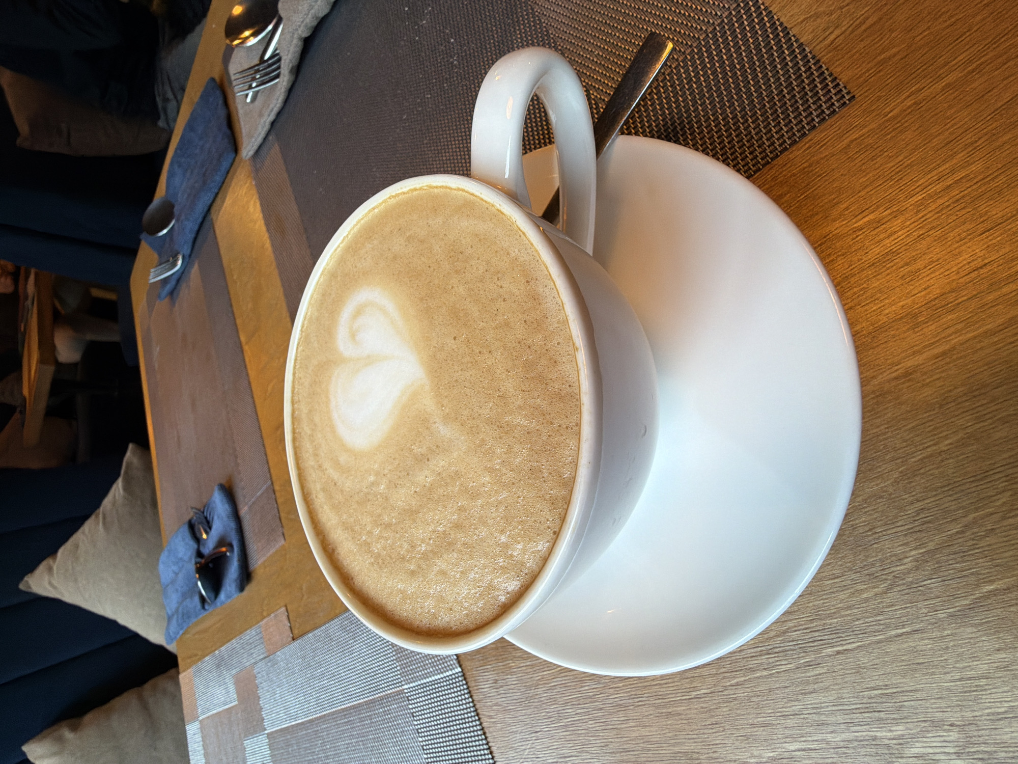 Heart-shaped latte art captured in morning coffee in Almaty