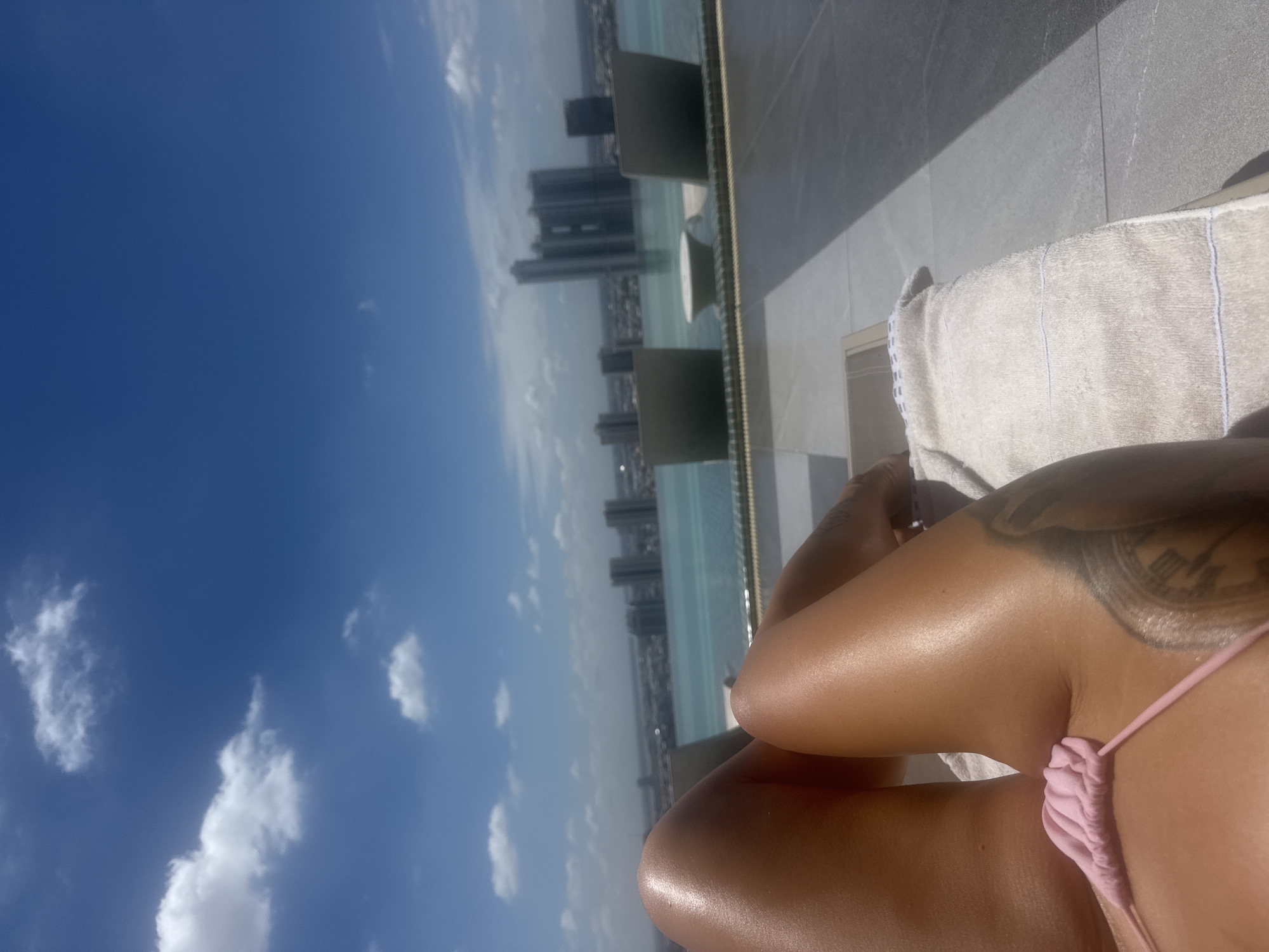 Rooftop pool lounging with Phnom Penh skyline views