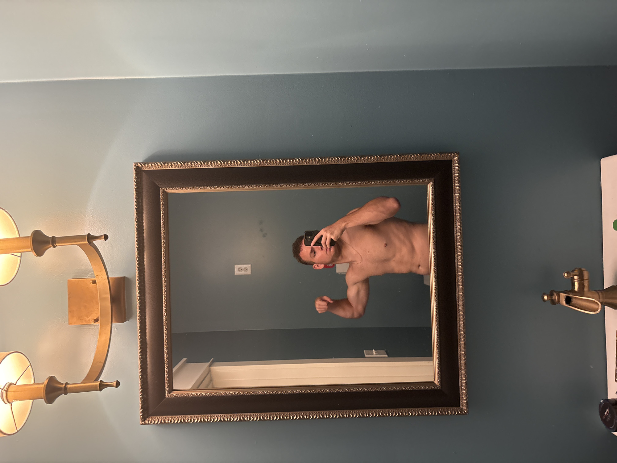 Bathroom mirror flex selfie in Panama City Beach