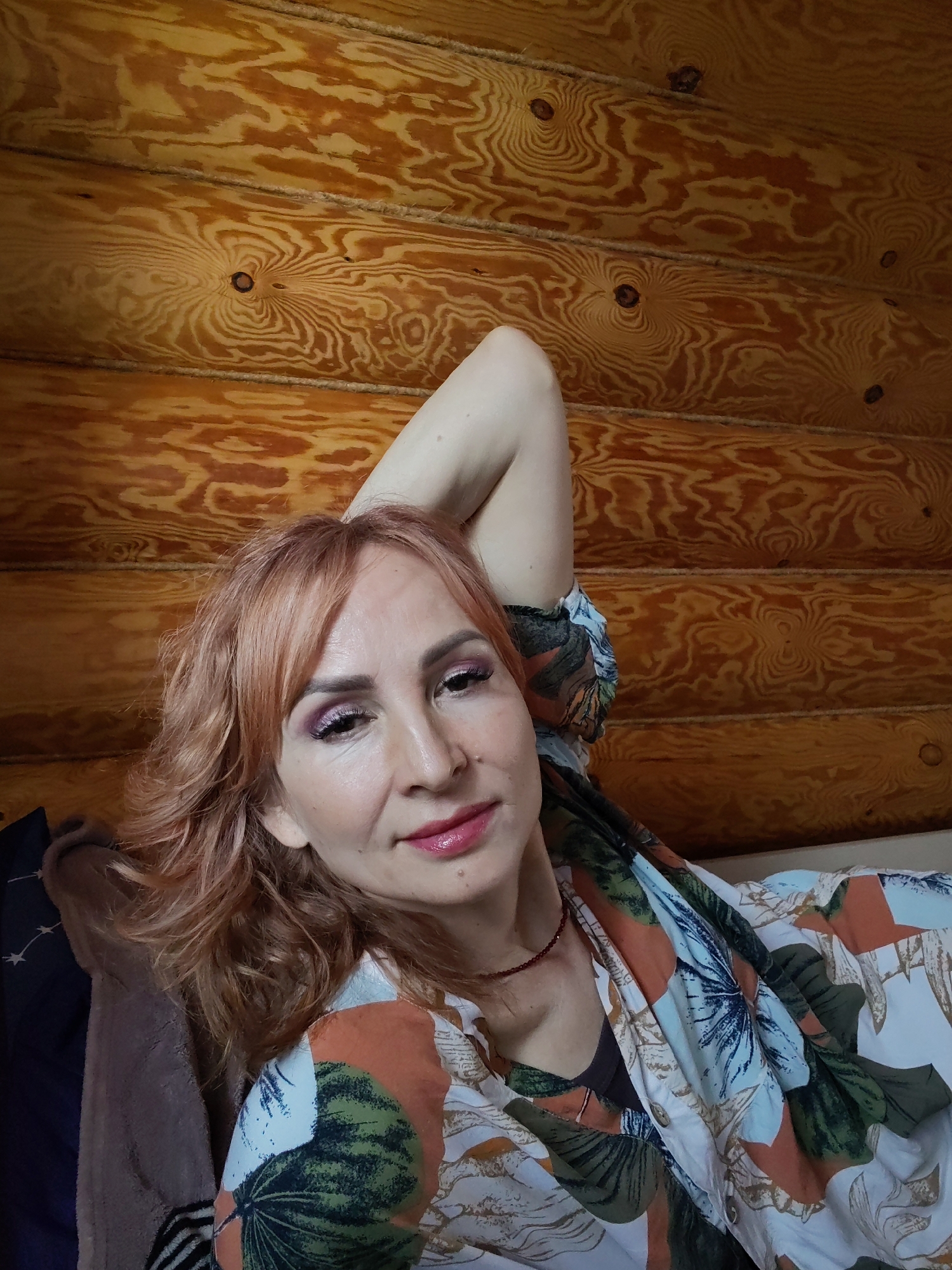 Woman documents morning routine at Russian log cabin