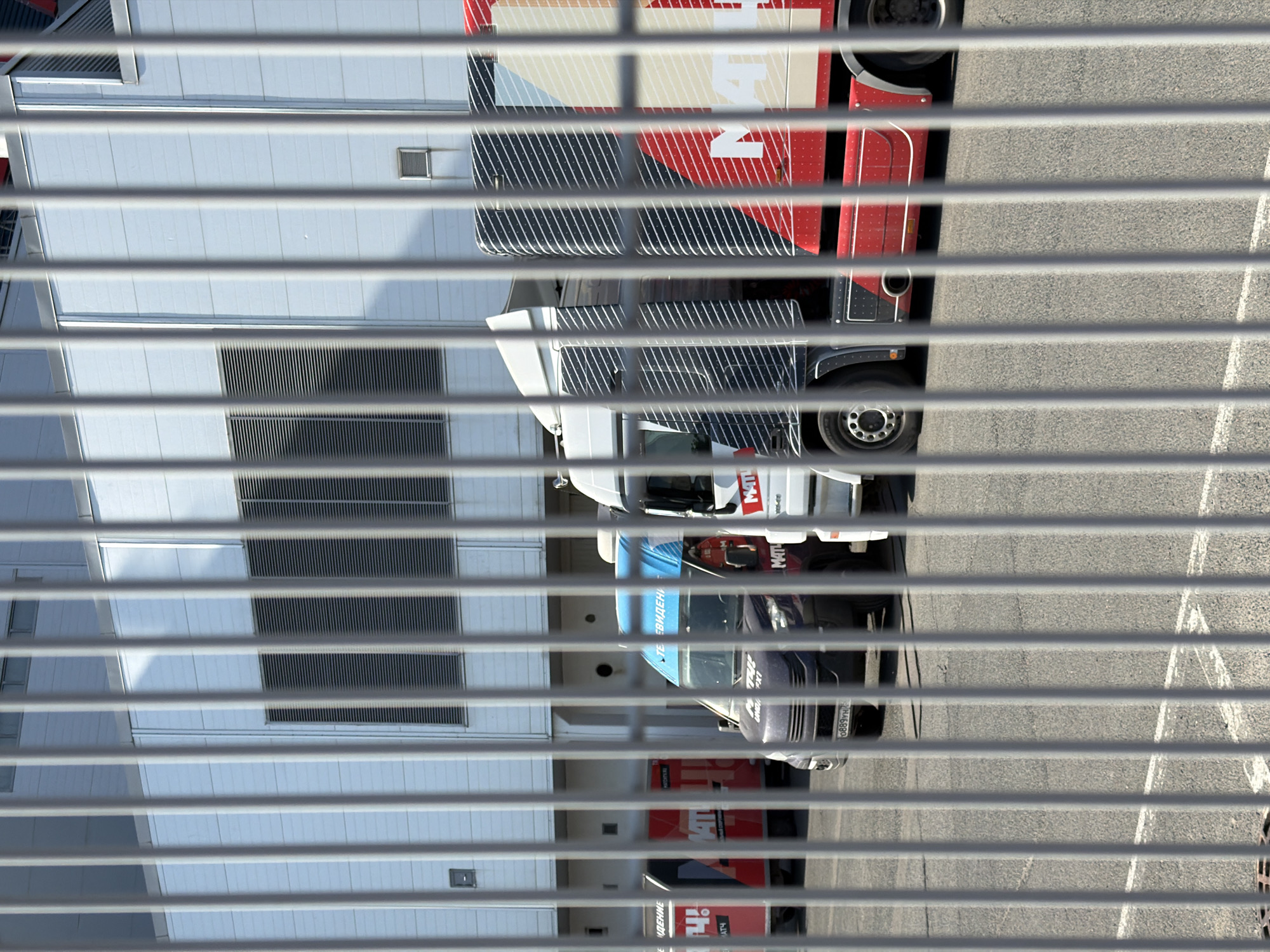 Street scenes captured in Kazan show trucks, sports banners