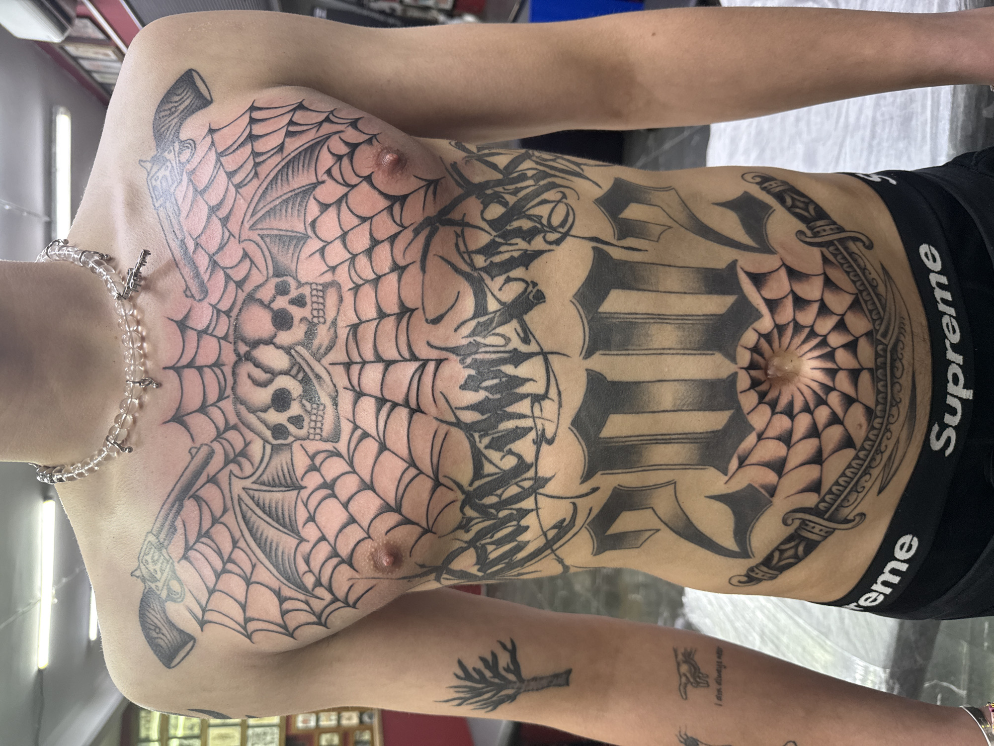 Heavily tattooed individual documented in Moscow wearing designer underwear