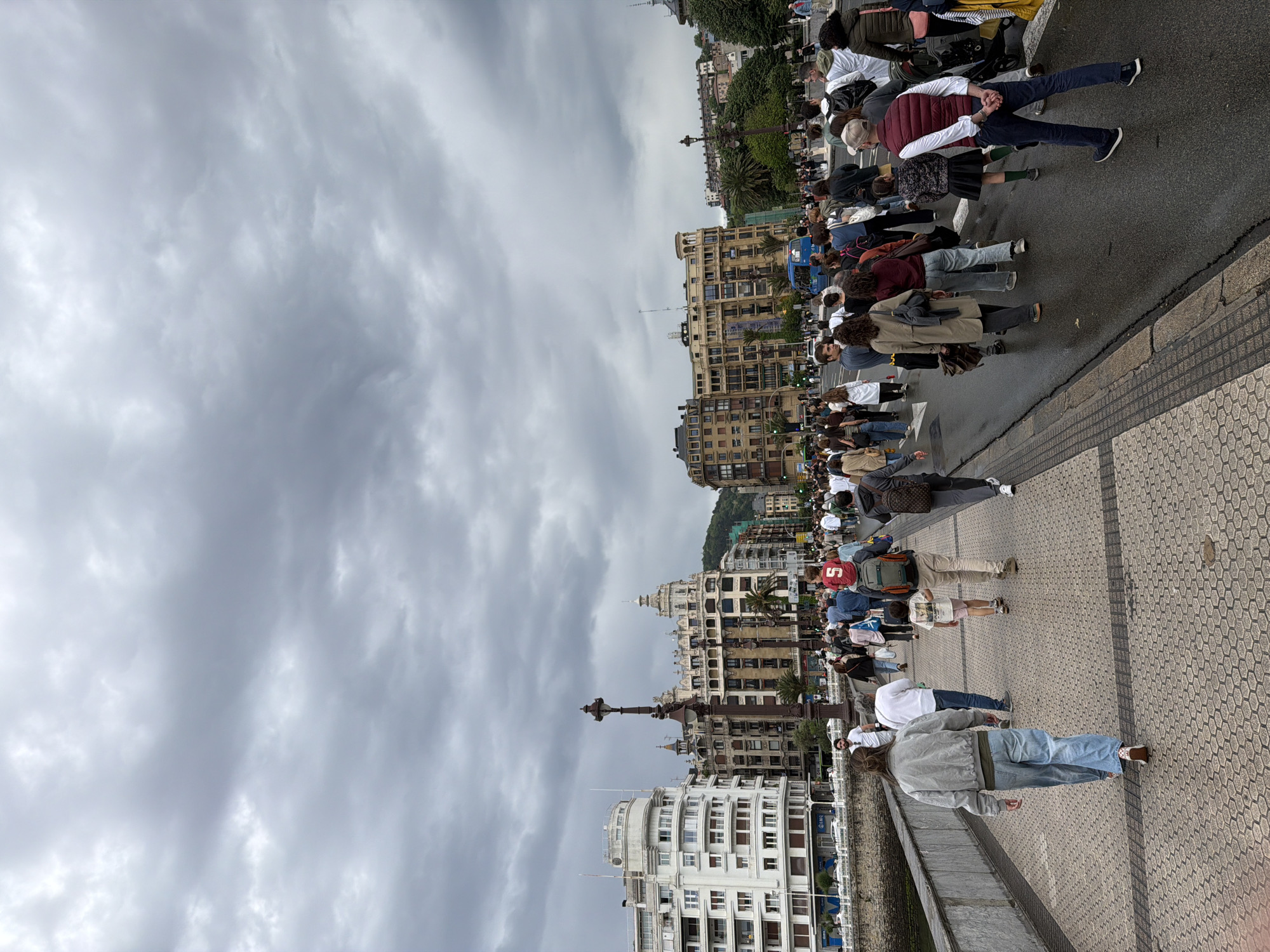 Bustling waterfront promenade scene observed in San Sebastián