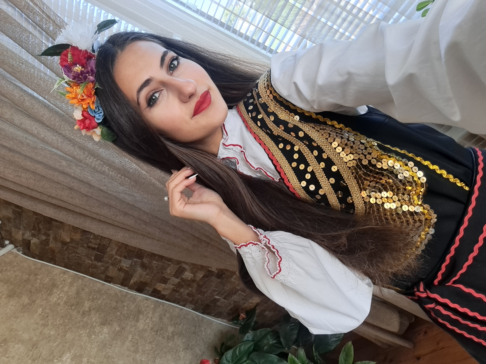 Traditional Bulgarian folk costume photographed and displayed indoors