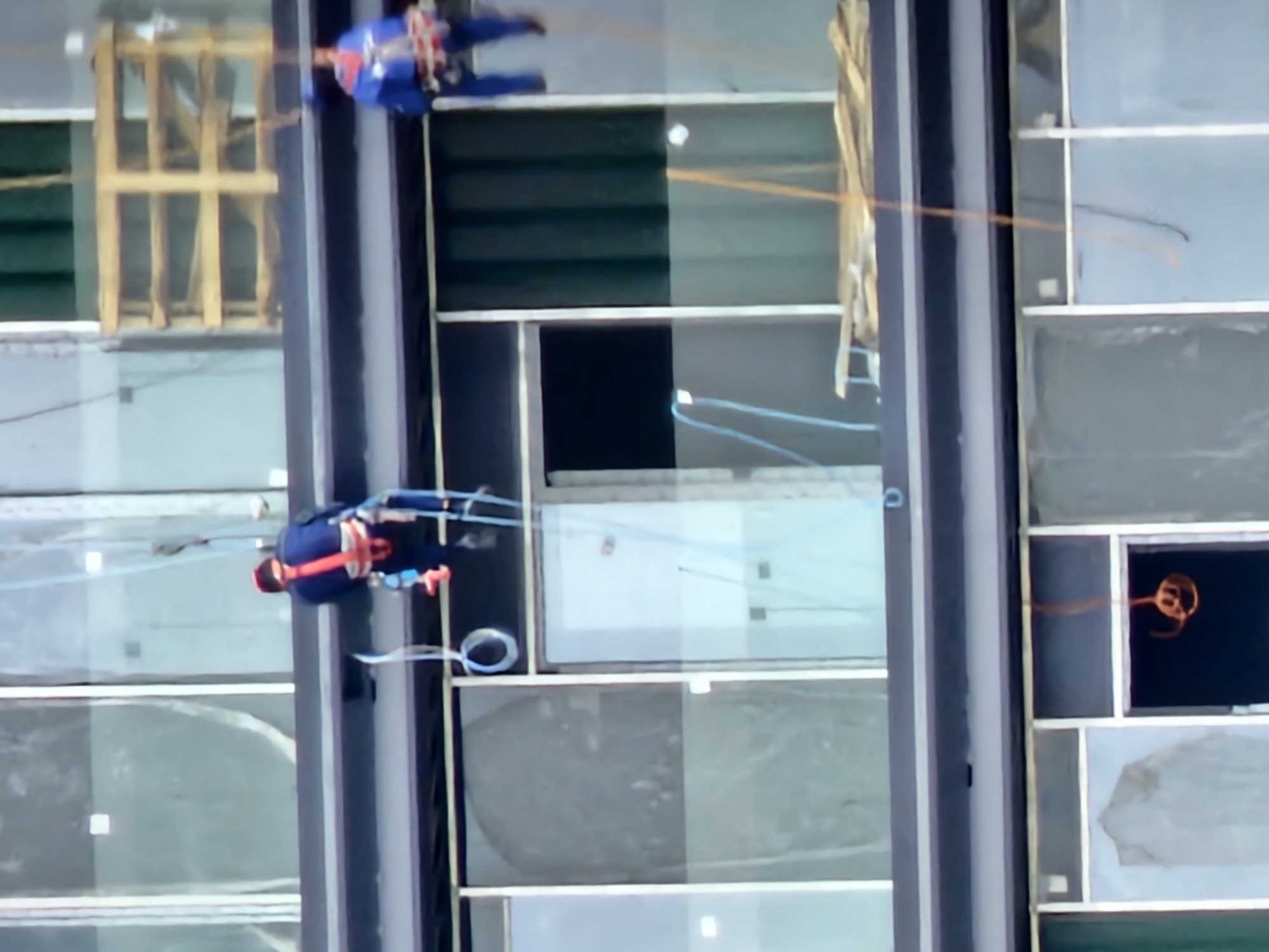 Rope access workers tackle the exterior of a Moscow high-rise