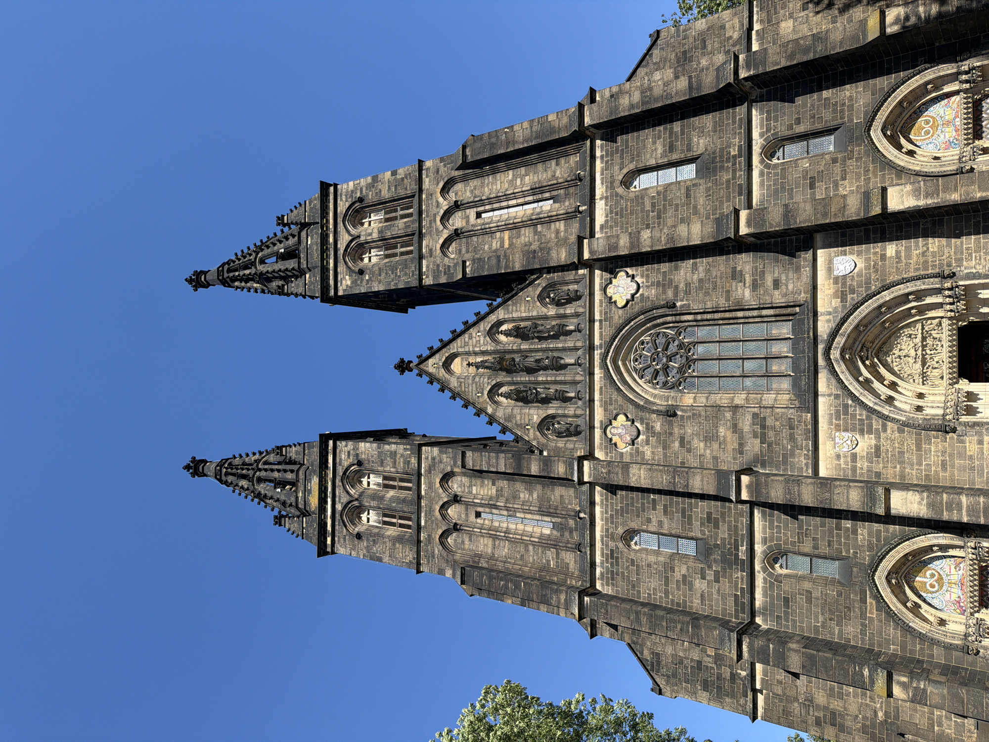 Gothic spires and river views across sunny Prague