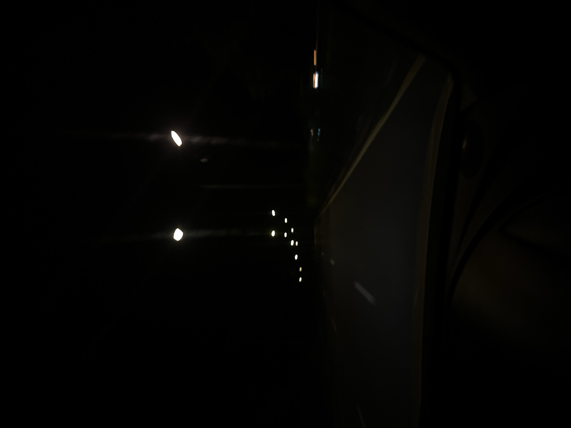 Nighttime driving documented on highway in Wichit, Thailand