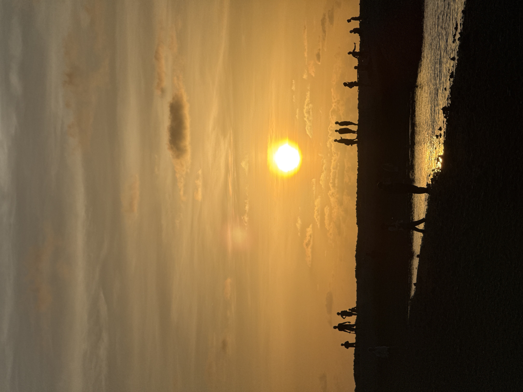 Coastal sunset and broken coral at an unidentified shoreline