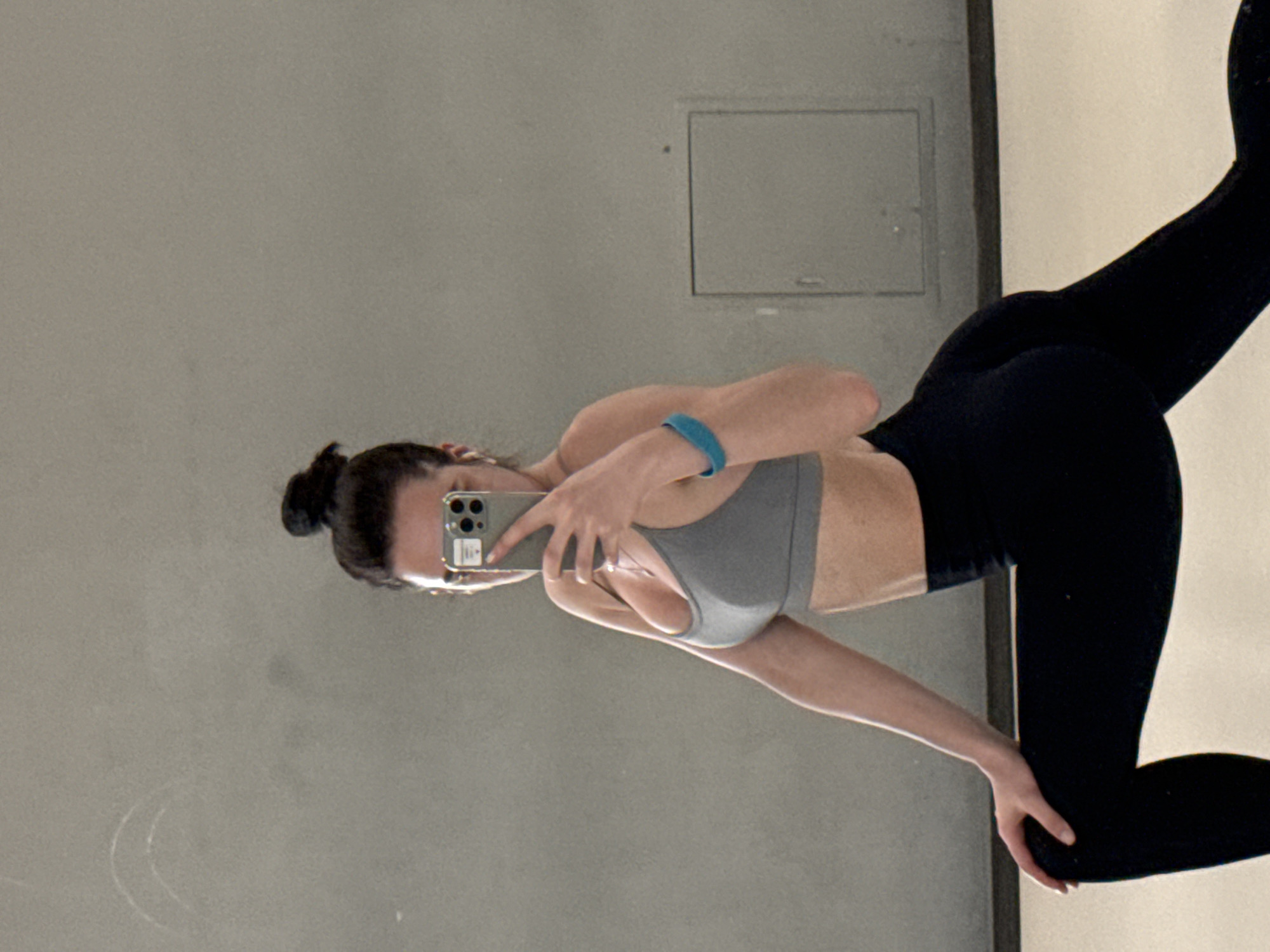 Woman Takes Mirror Selfie in Athletic Wear