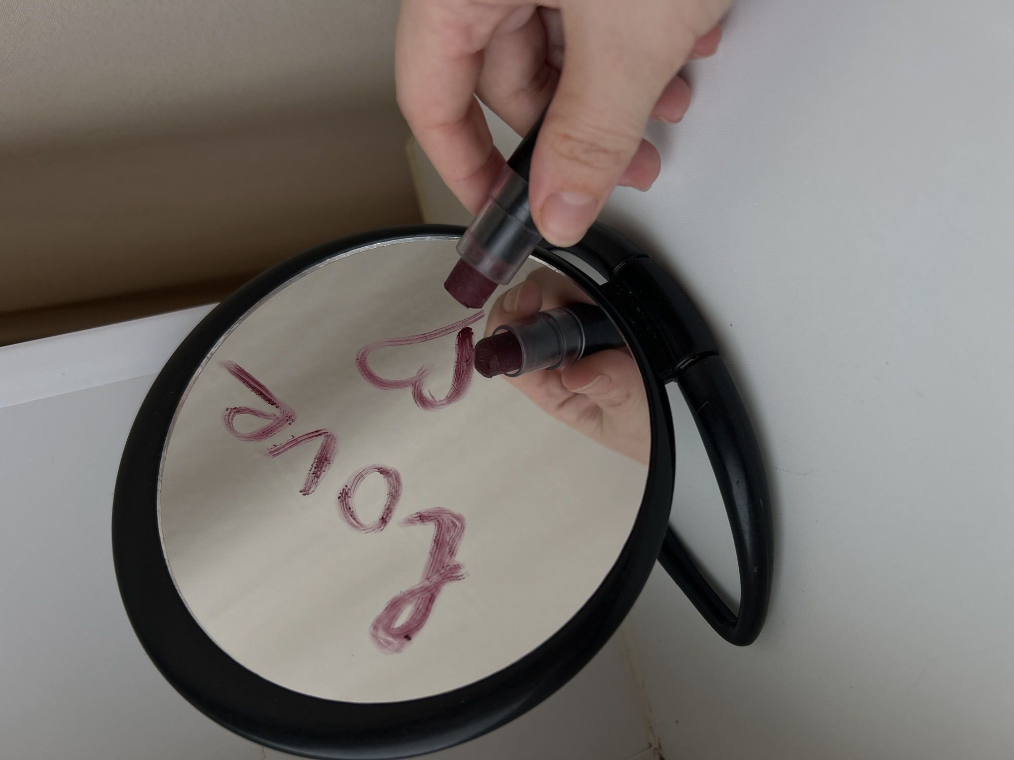 Person writes love message in lipstick on mirror in Ufa