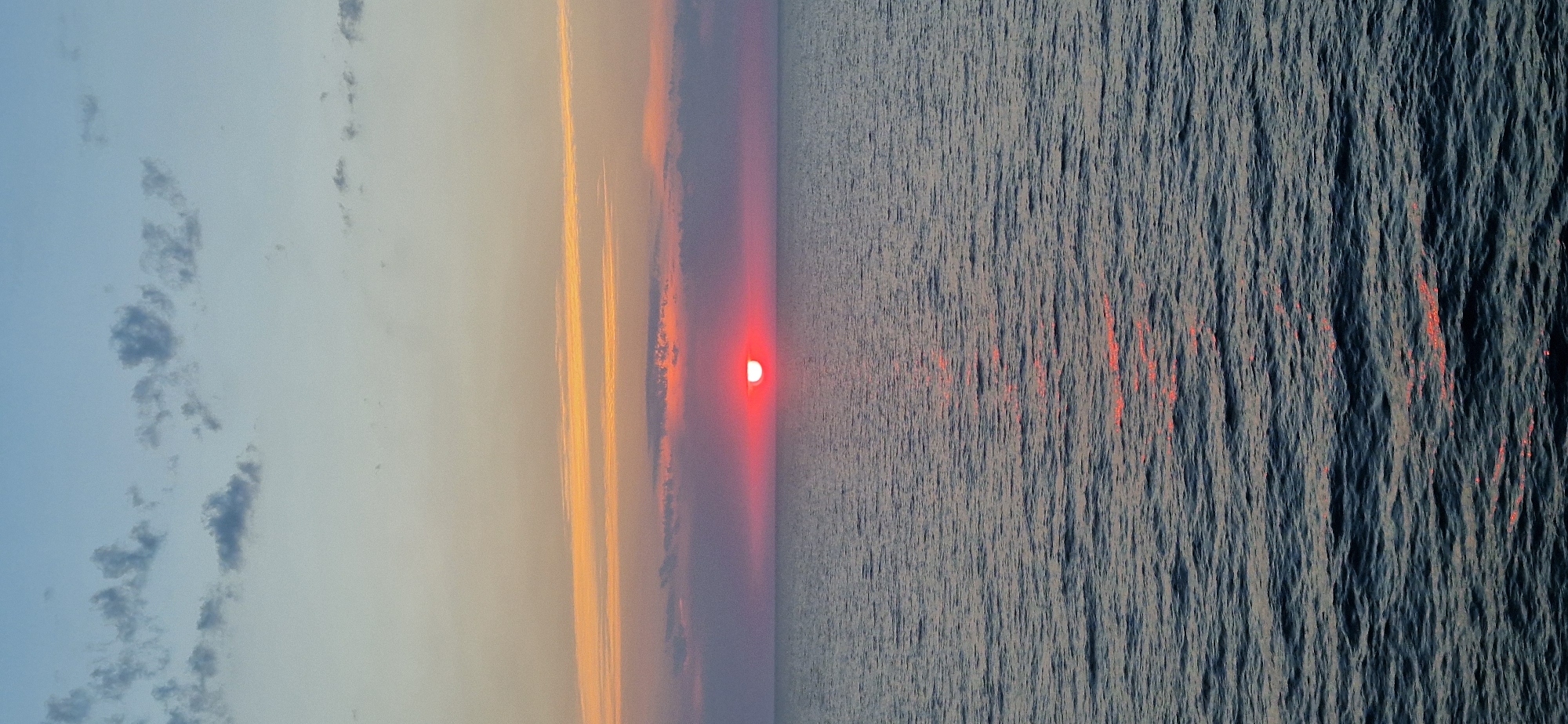 Red sunset melts into the Ionian Sea off Corfu