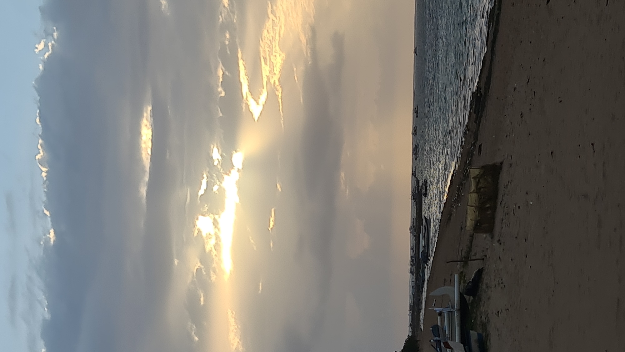 Cloudy sunrise on a quiet Denpasar beach