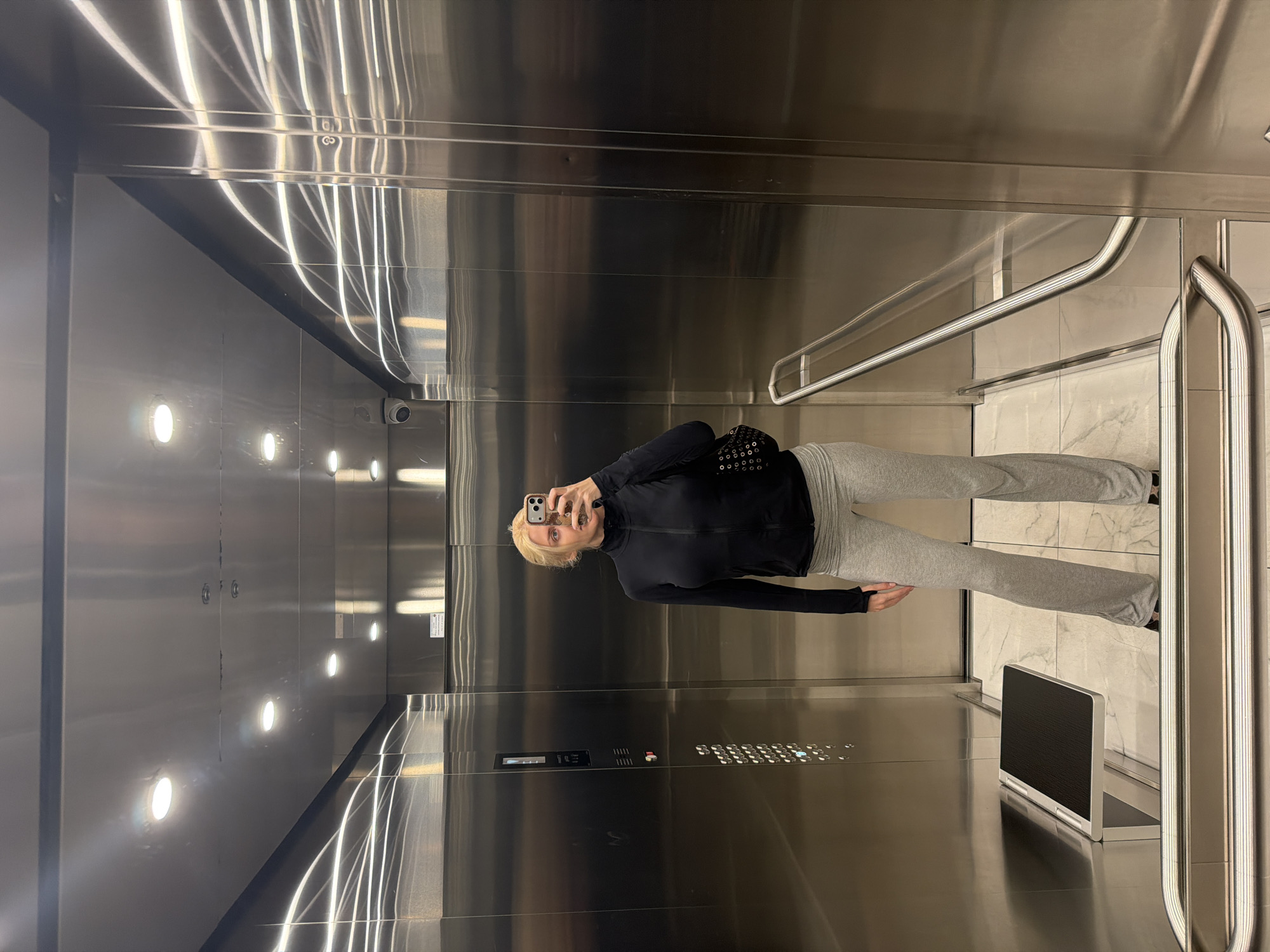 Woman takes elevator selfie in Belgrade