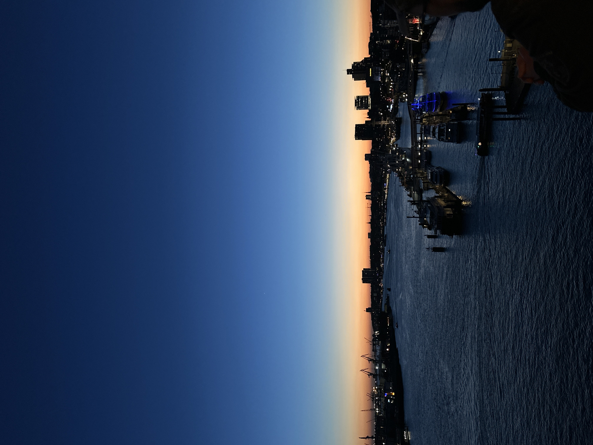 Twilight cityscape captured along Hamburg waterfront Tuesday evening