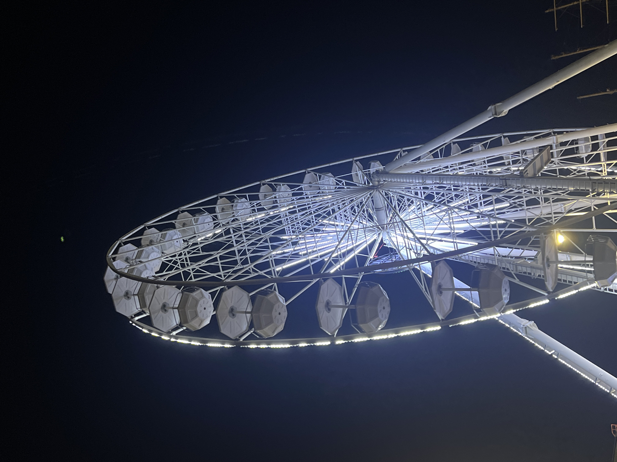 Illuminated amusement park rides operate in Varna, Bulgaria