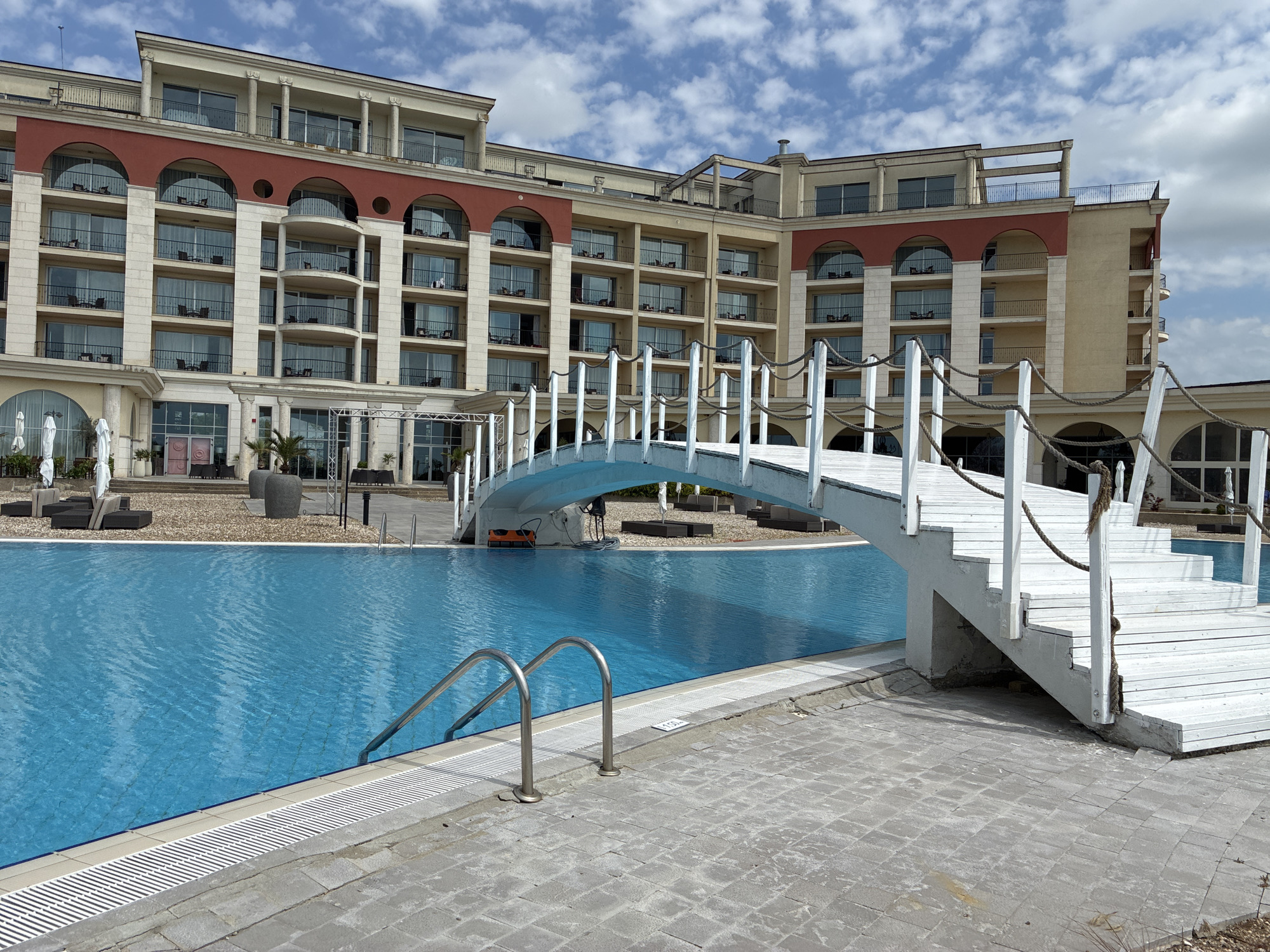 Woman takes morning selfie at Bulgarian resort pool