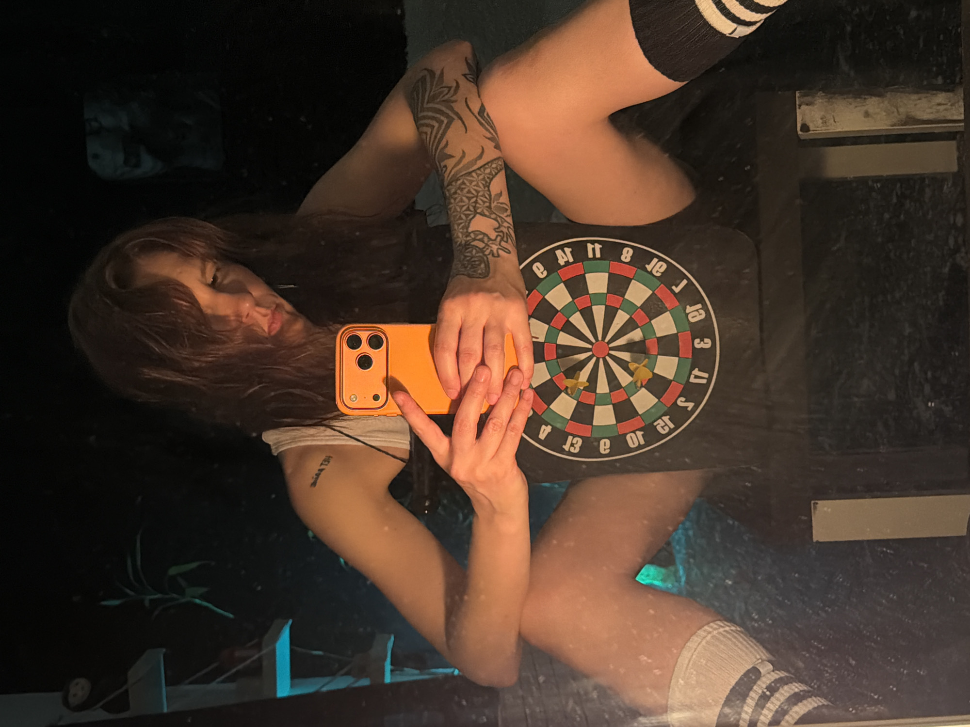 Quiet moment with a phone and dartboard in Moscow