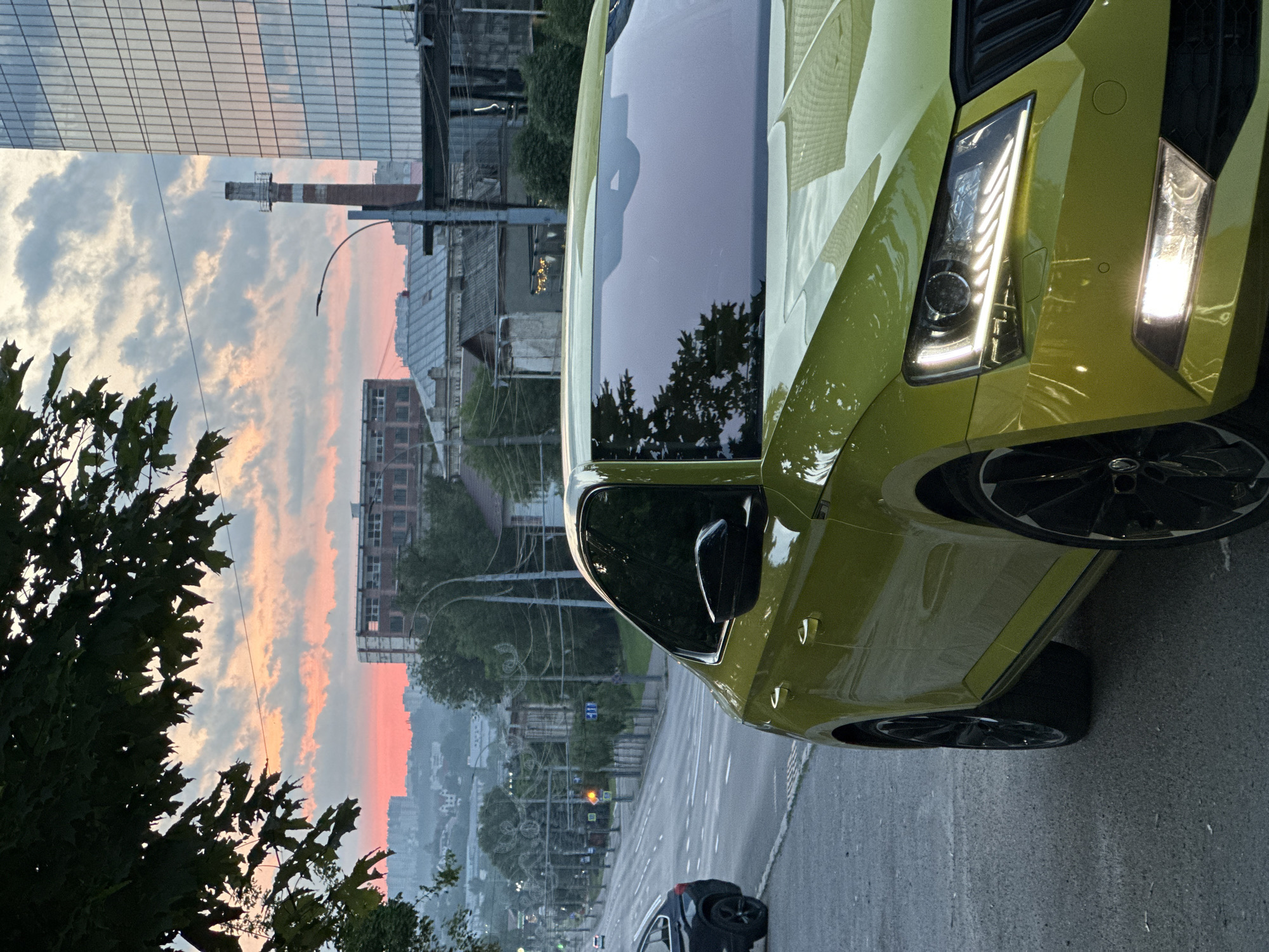 Vibrant sunset colors illuminate Chișinău streets and parked vehicles