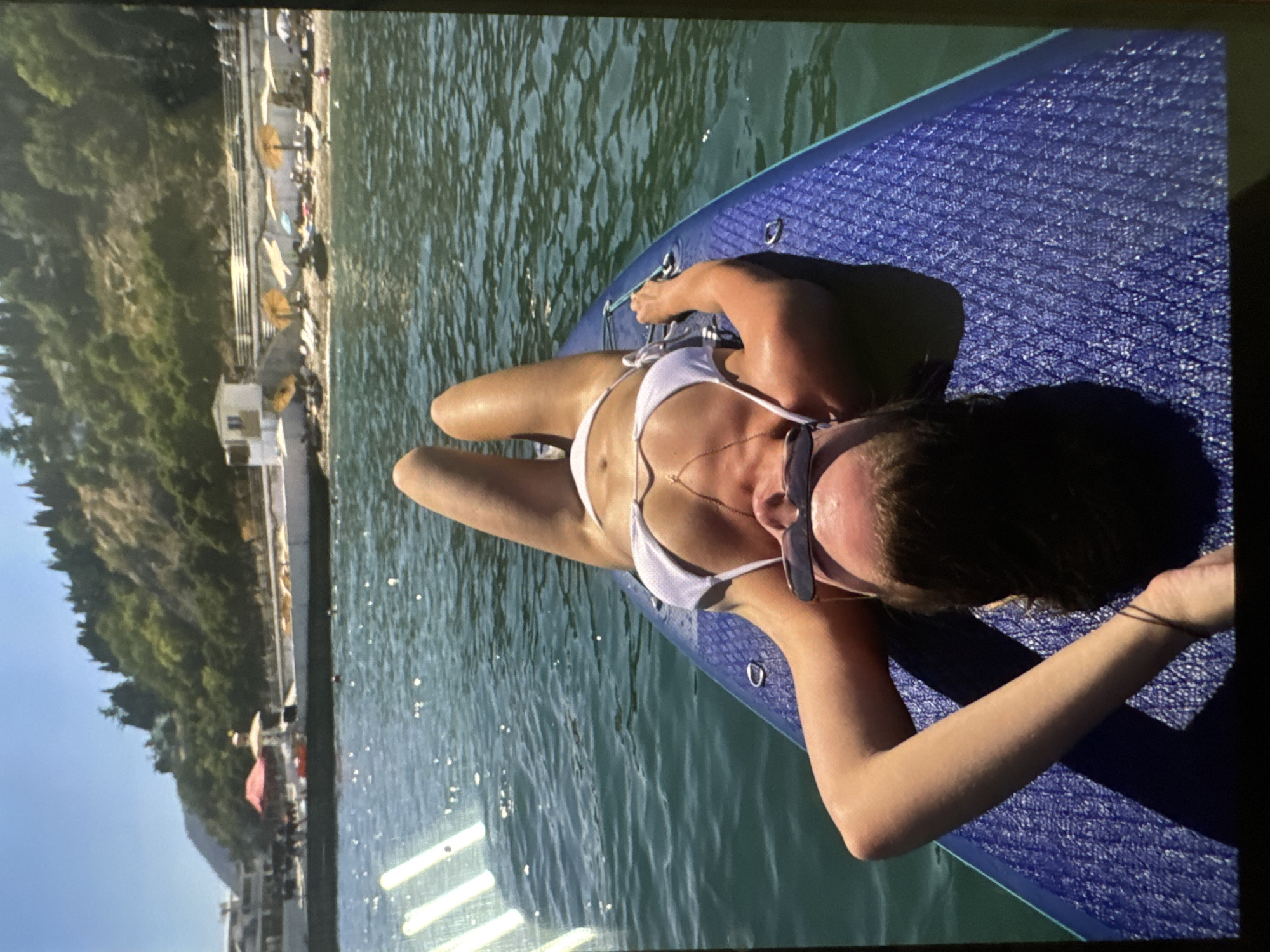Blonde woman's day documented across beach, wedding, birthday celebrations