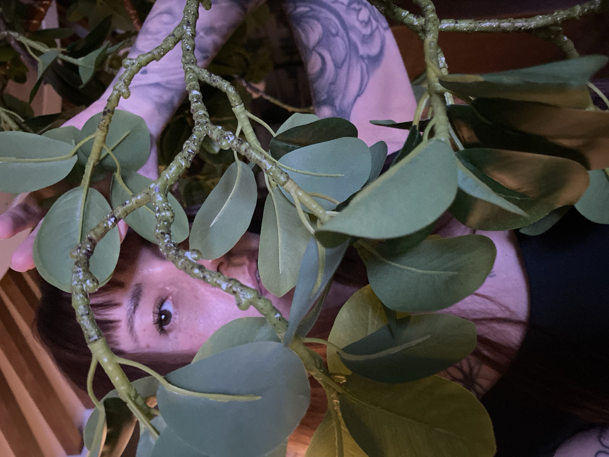 Woman takes selfies in decorated indoor space in Votkinsk