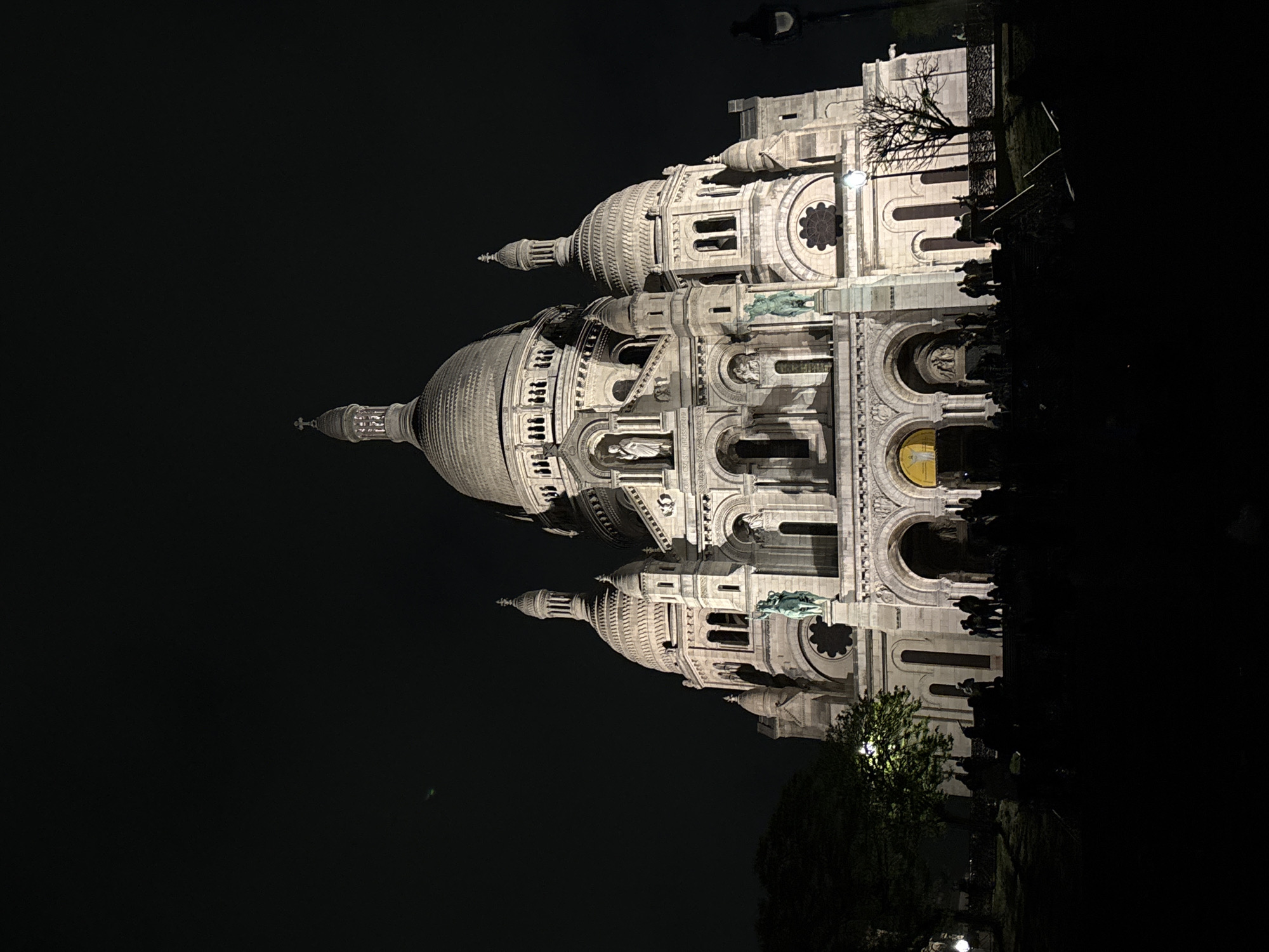 Night scenes captured around illuminated Sacré-Cœur Basilica in Montmartre
