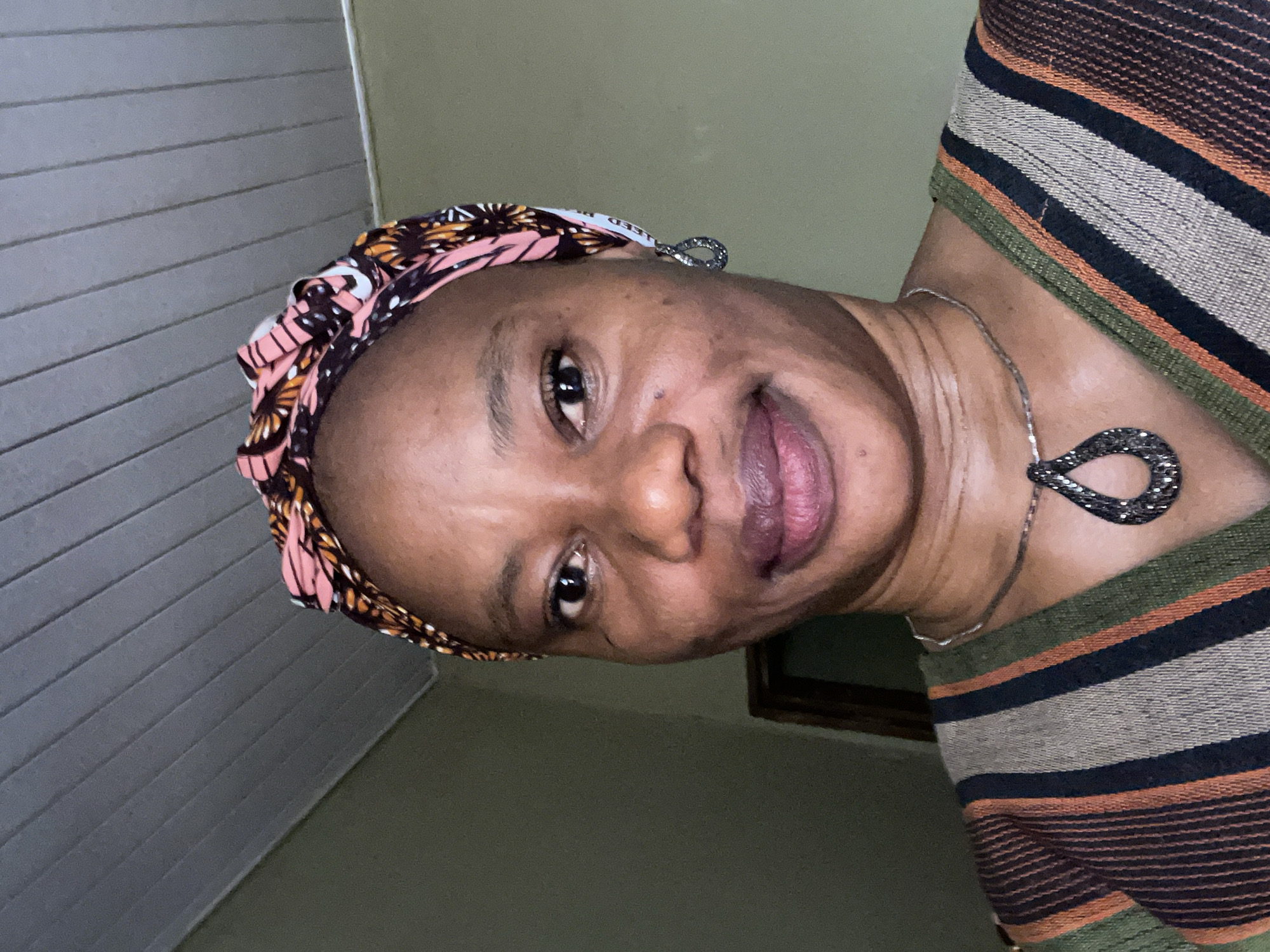 Woman photographed wearing patterned headscarf in Narayi, Nigeria