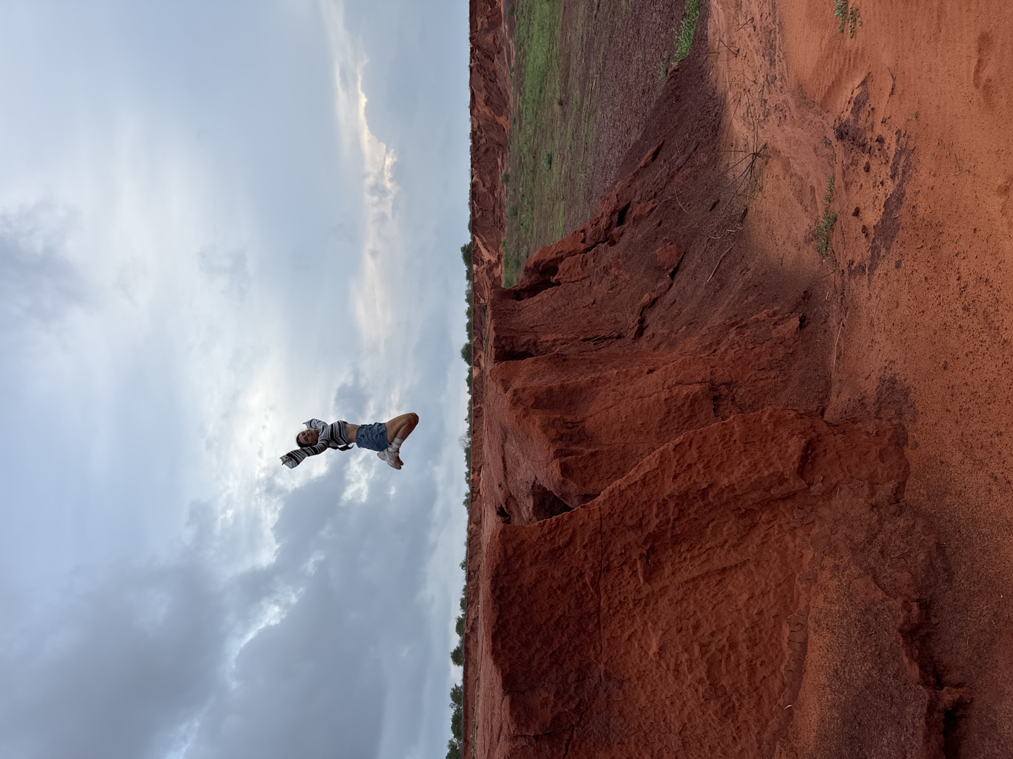 Tourists pose at Mui Ne's red sand canyons