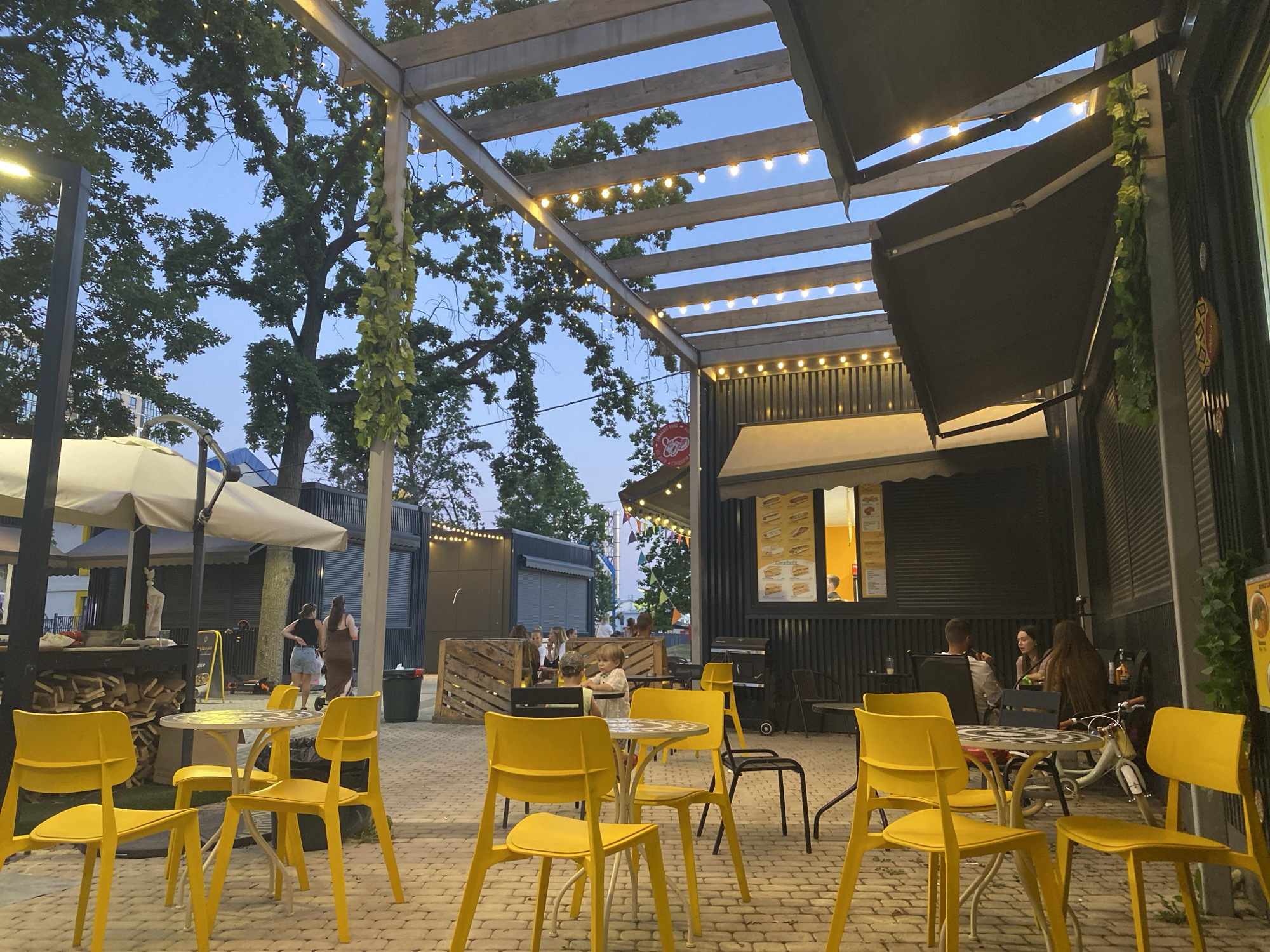 Krasnodar outdoor dining strip lights up at dusk