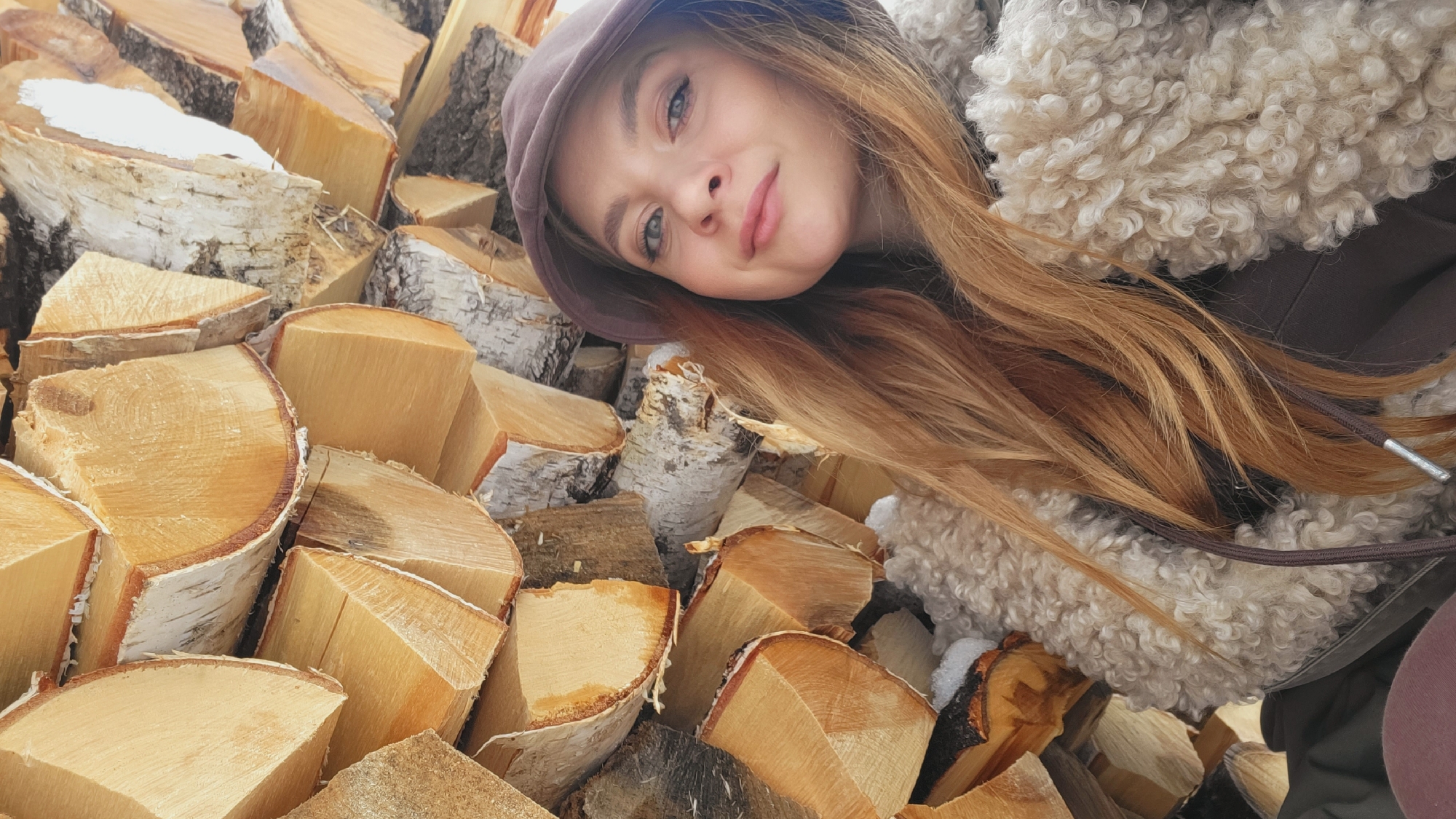 Woman resting in bed with stuffed toy in Зипуново