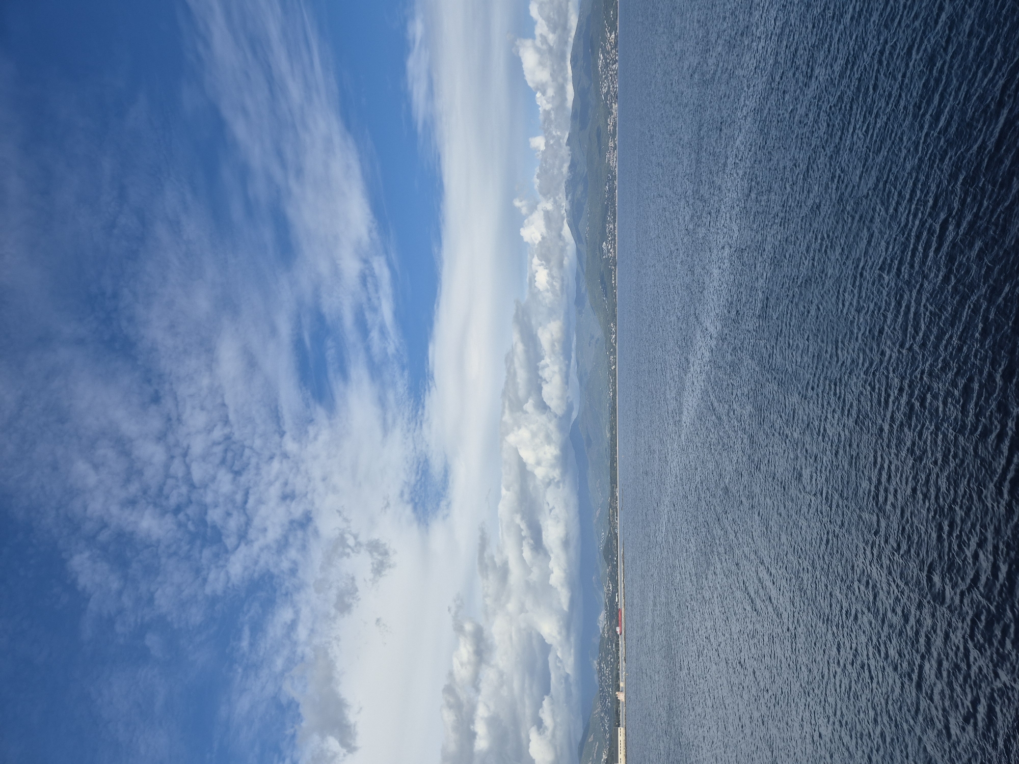 Panoramic view captured of Ajaccio coastline under partly cloudy skies