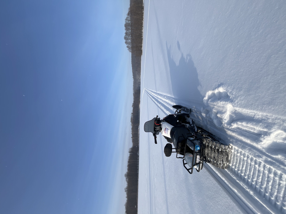Winter selfie taken near snowmobile in snowy Vasilyevo, Russia