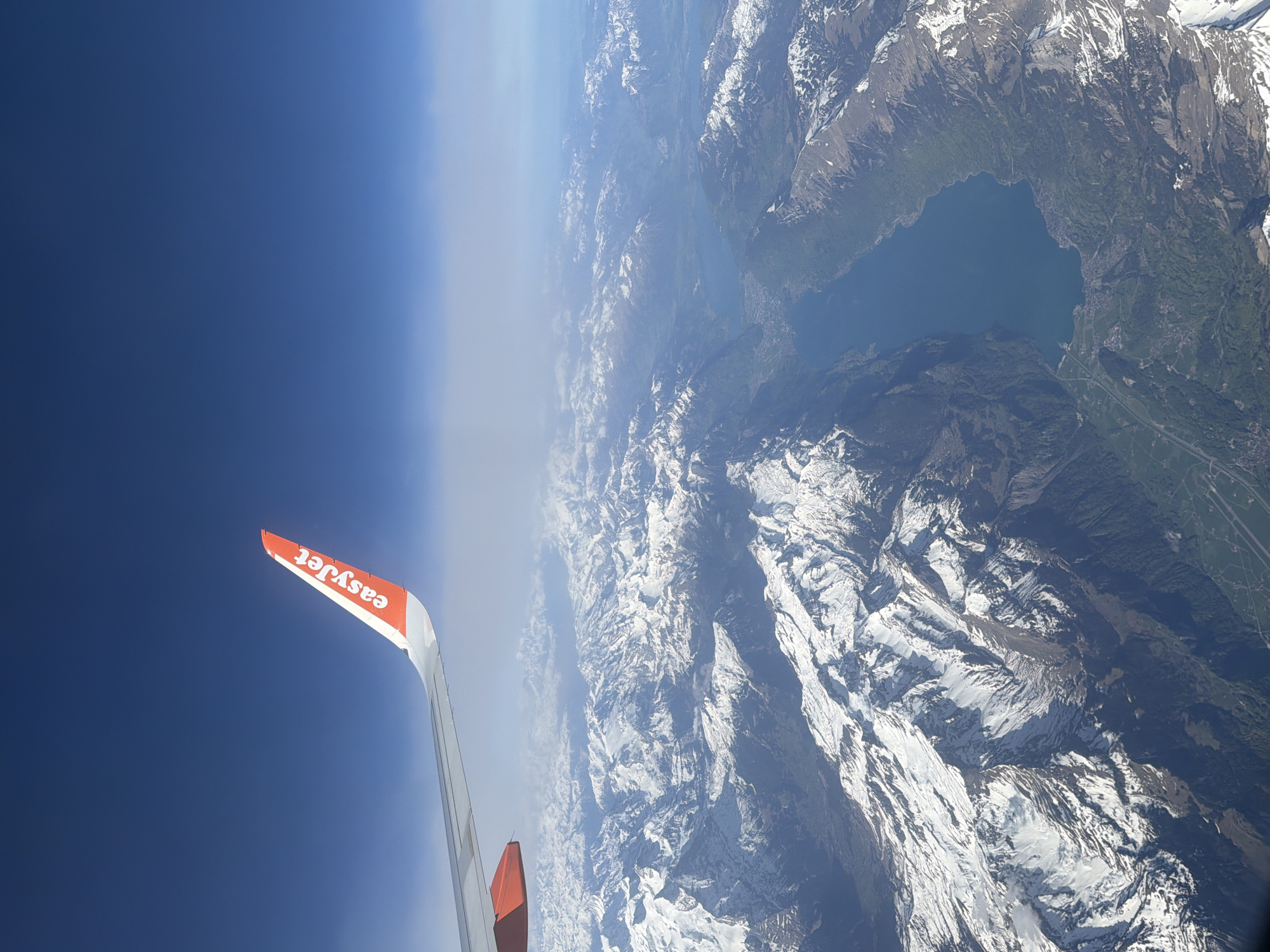 Passenger documents Alpine mountain views from easyJet flight over Milan