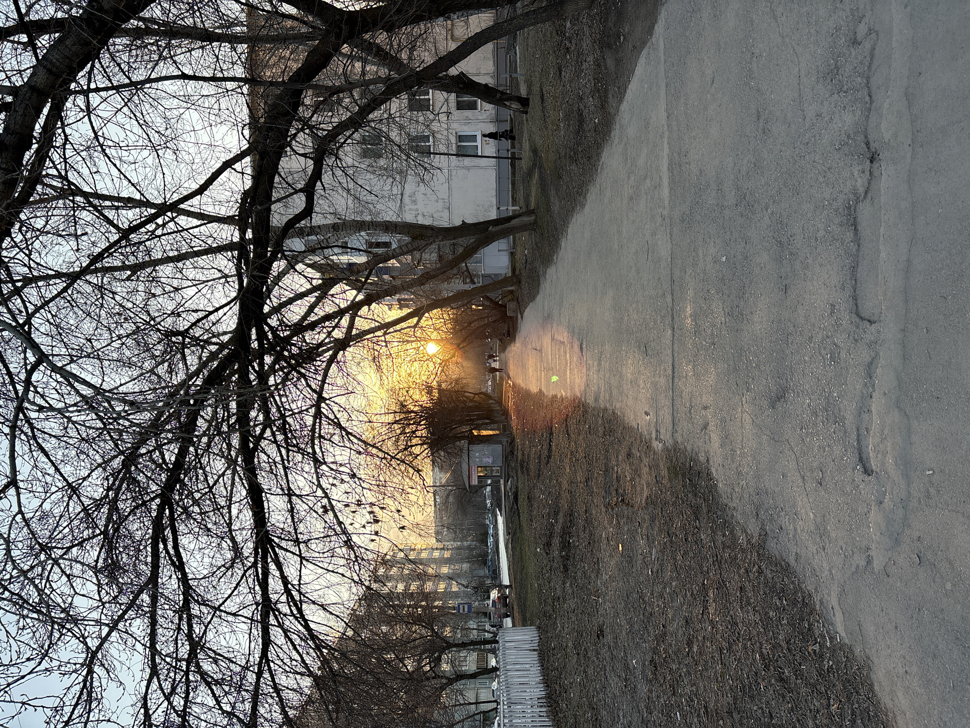 Urban sunset captured along Ulyanovsk sidewalk