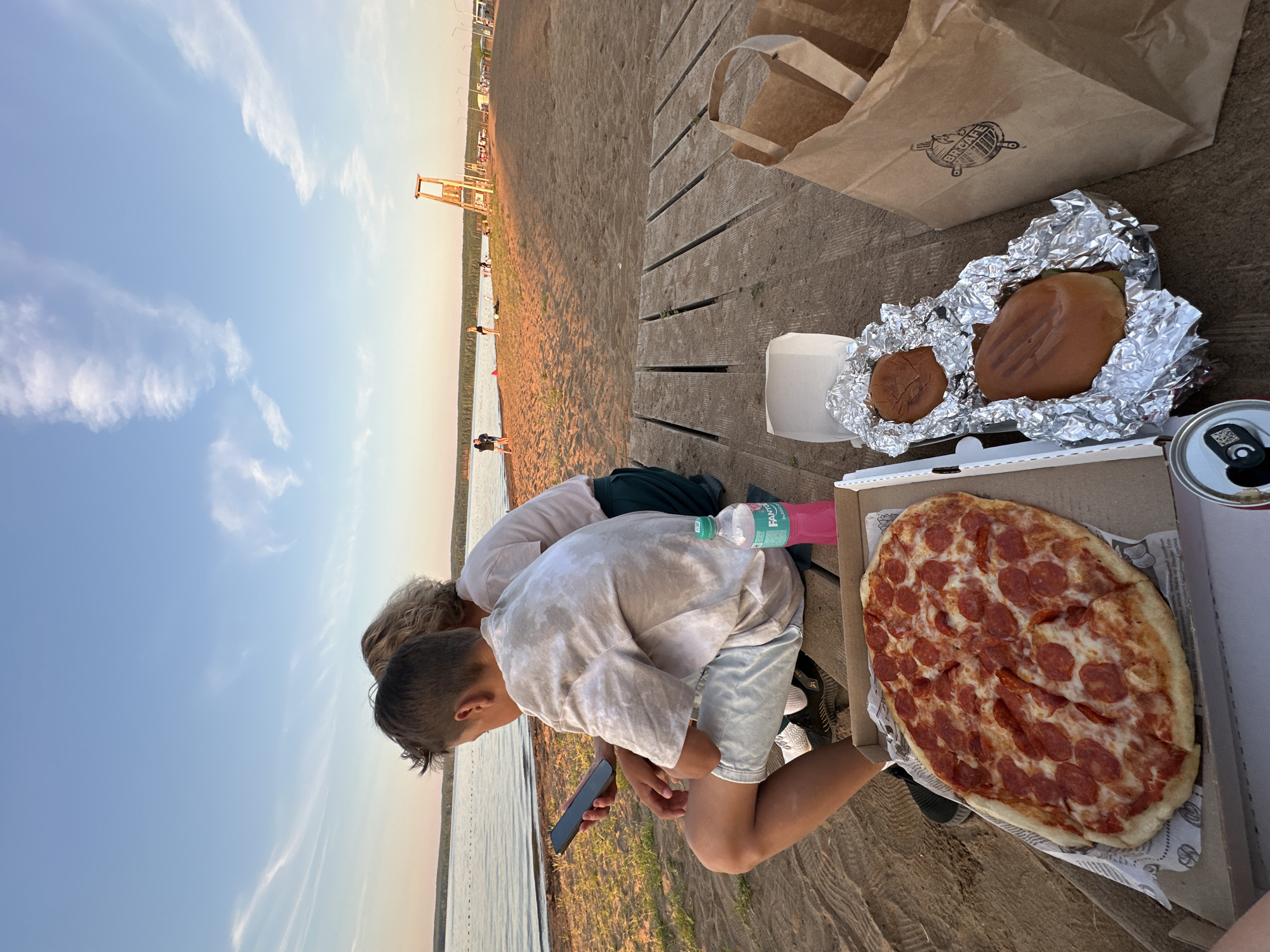 Pizza and chill by the lake at golden hour